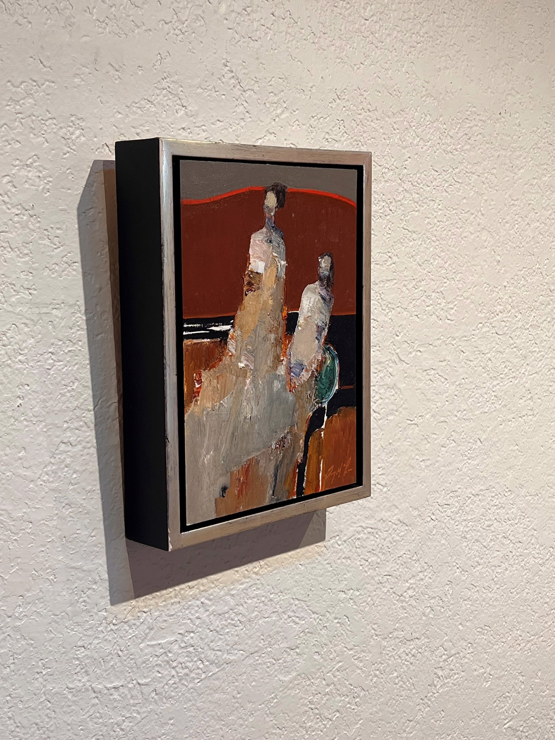 A painting of two people sitting on a couch.