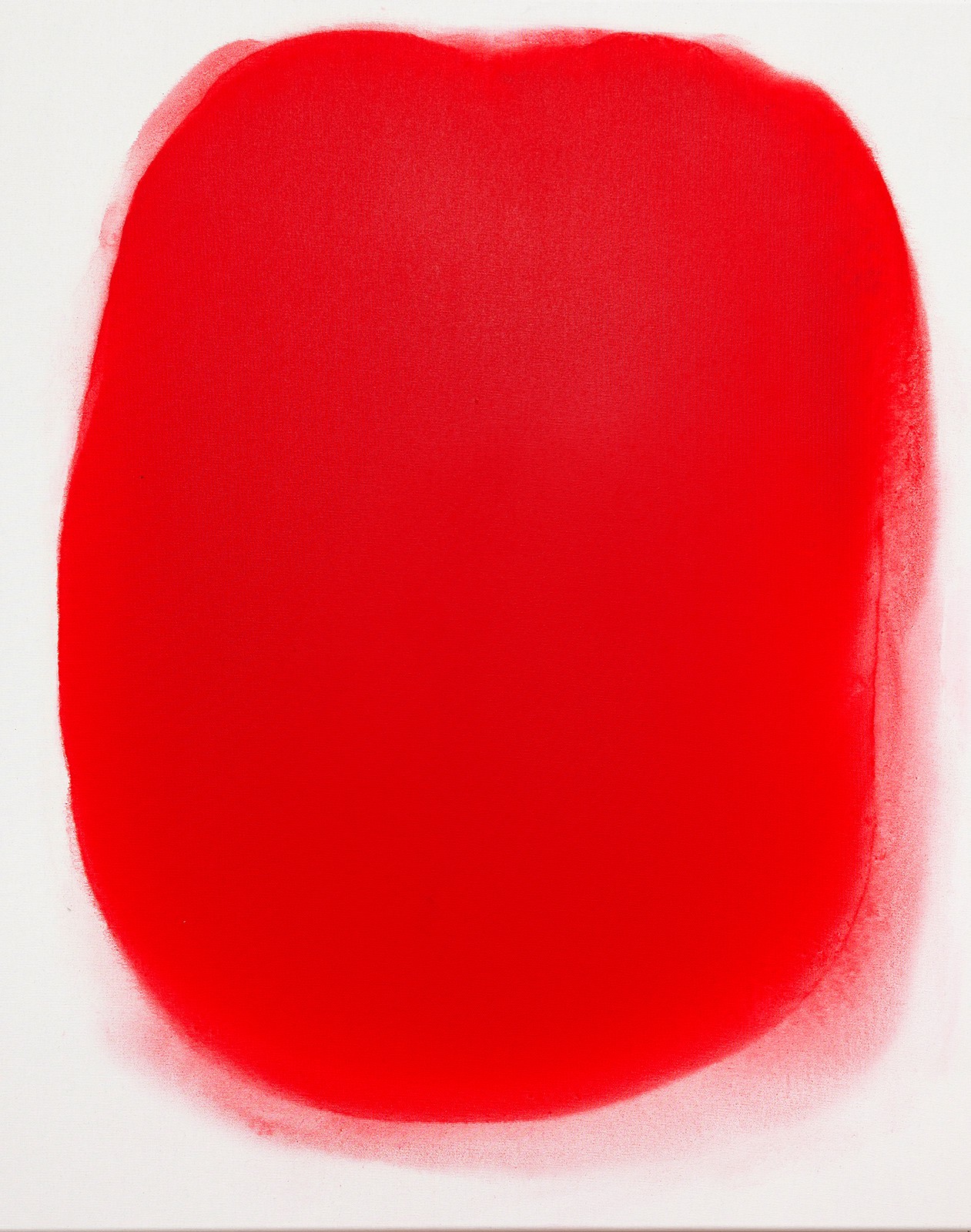 A red circle painted on a white background. 