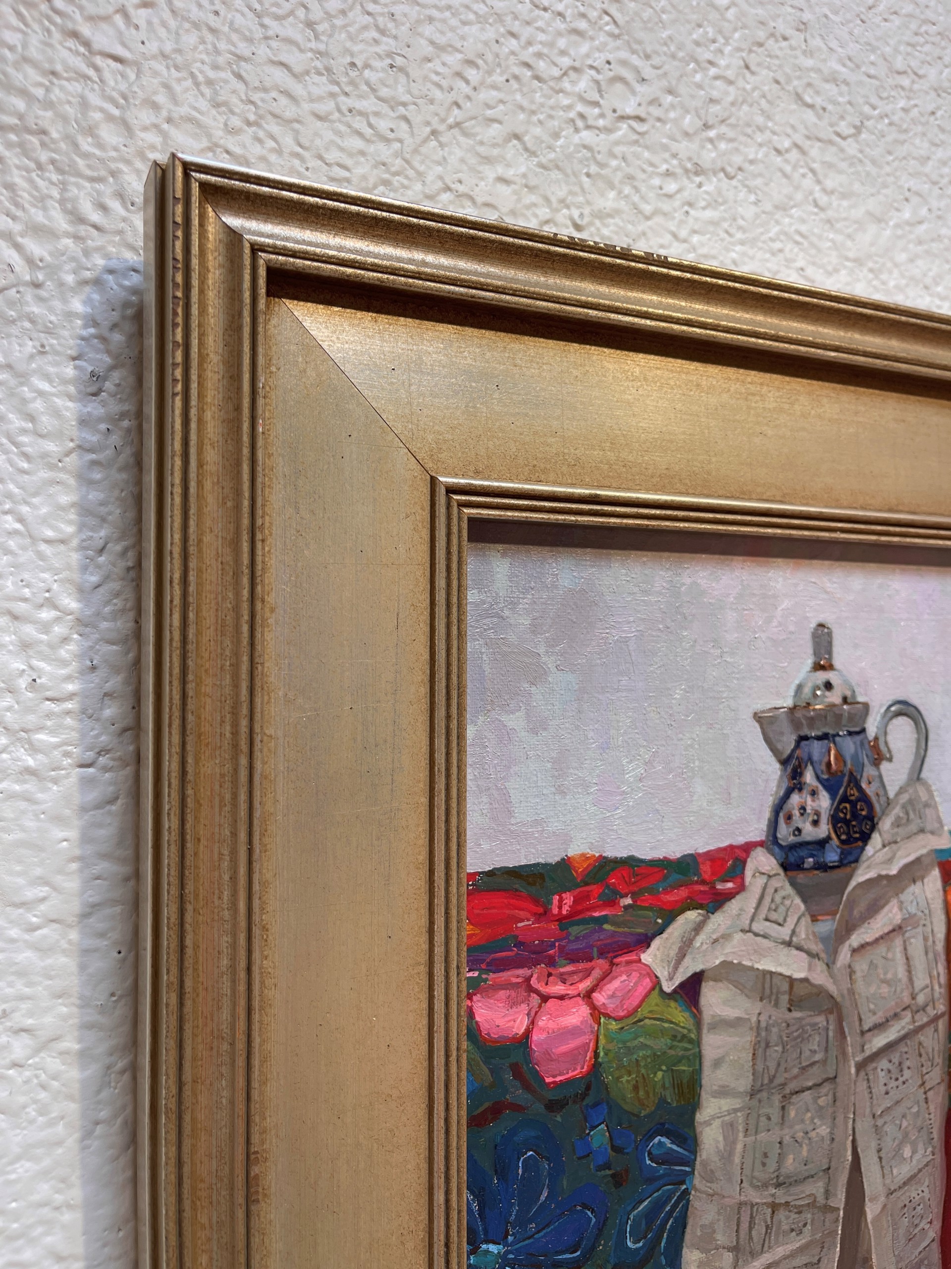 A painting of a teapot and a newspaper on a table with flowers.