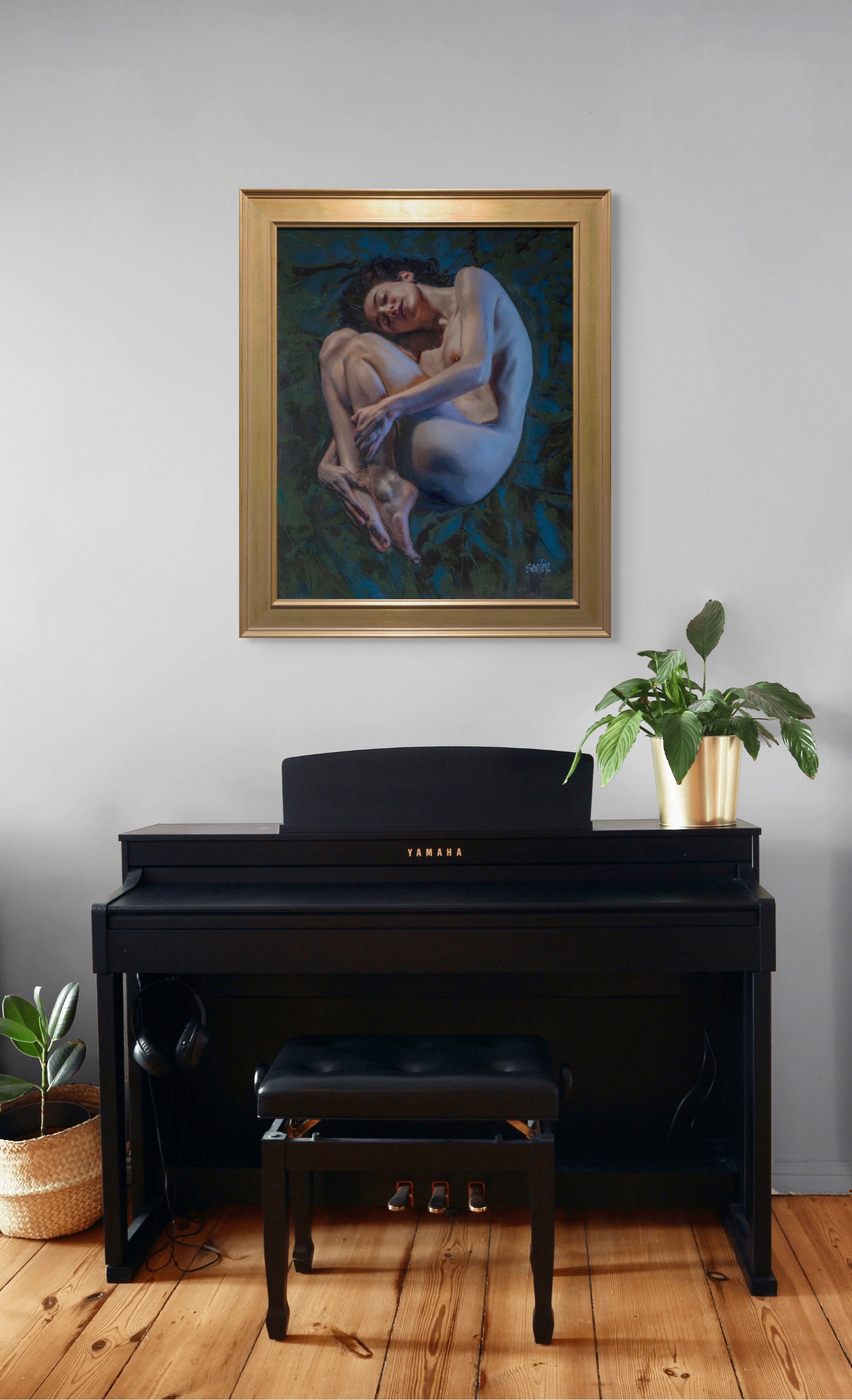 A painting of a nude woman laying down on a blue background.