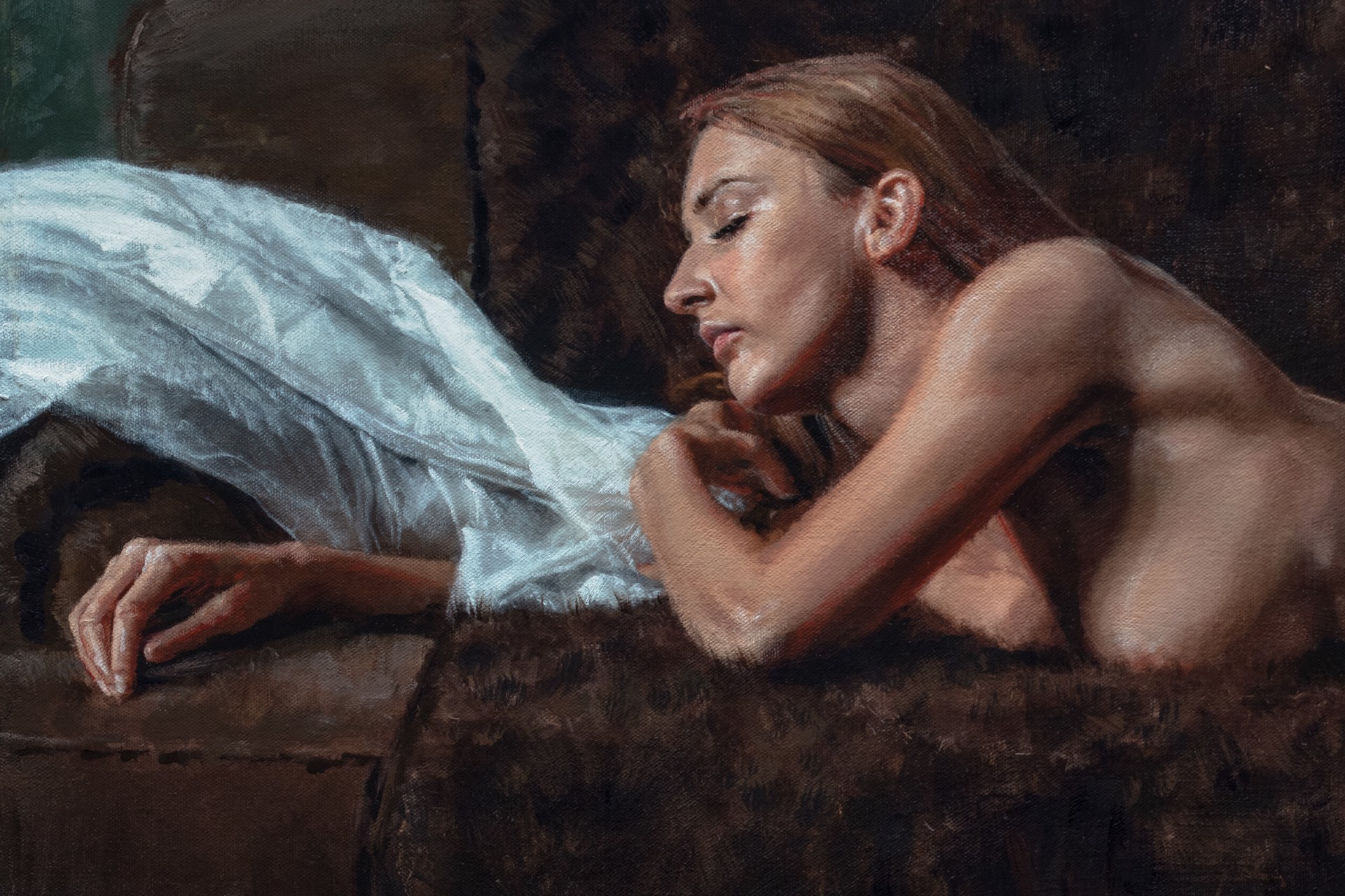A nude figure rests on a dark sofa with a white sheet nearby.