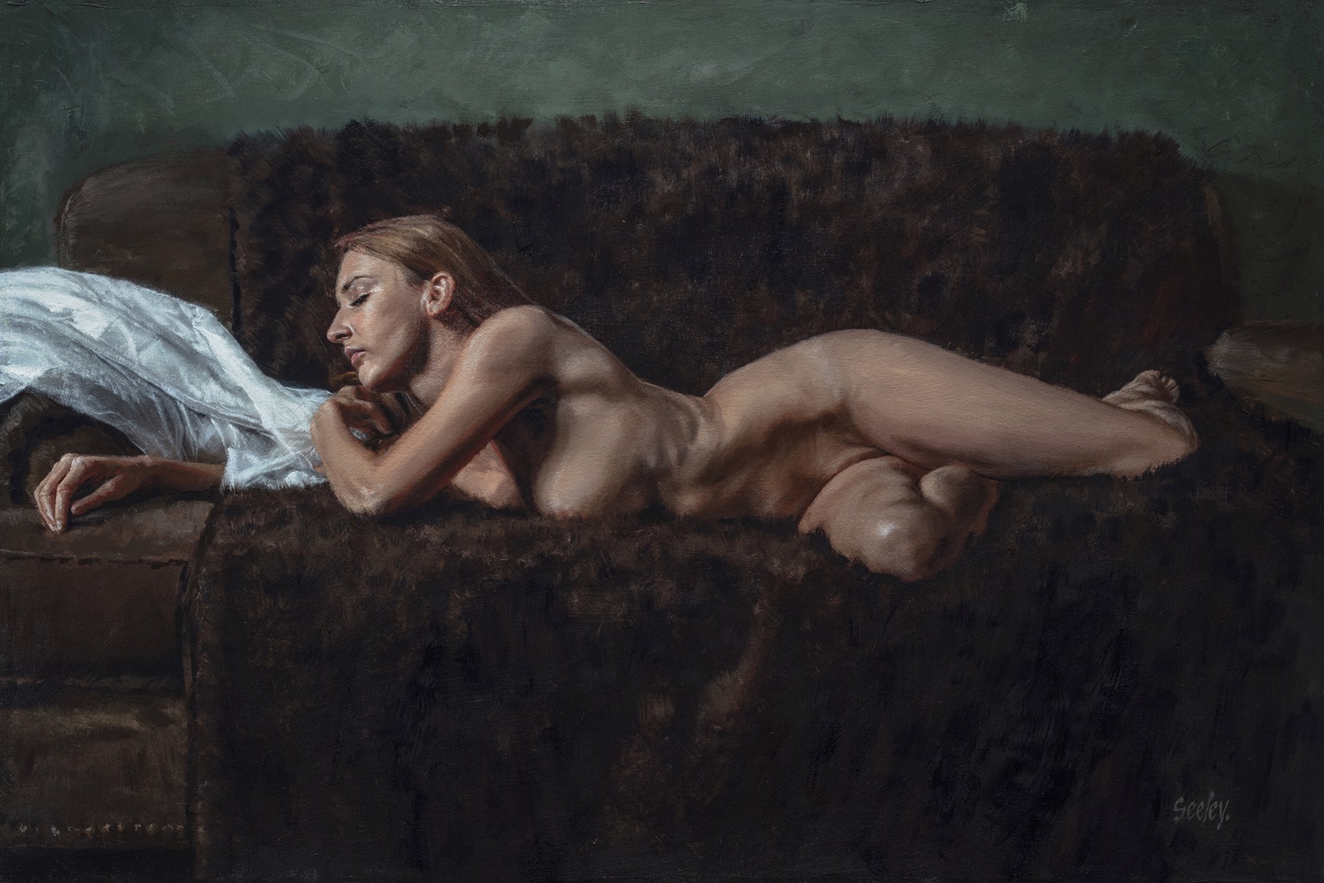 A nude figure rests on a dark sofa with a white sheet nearby.