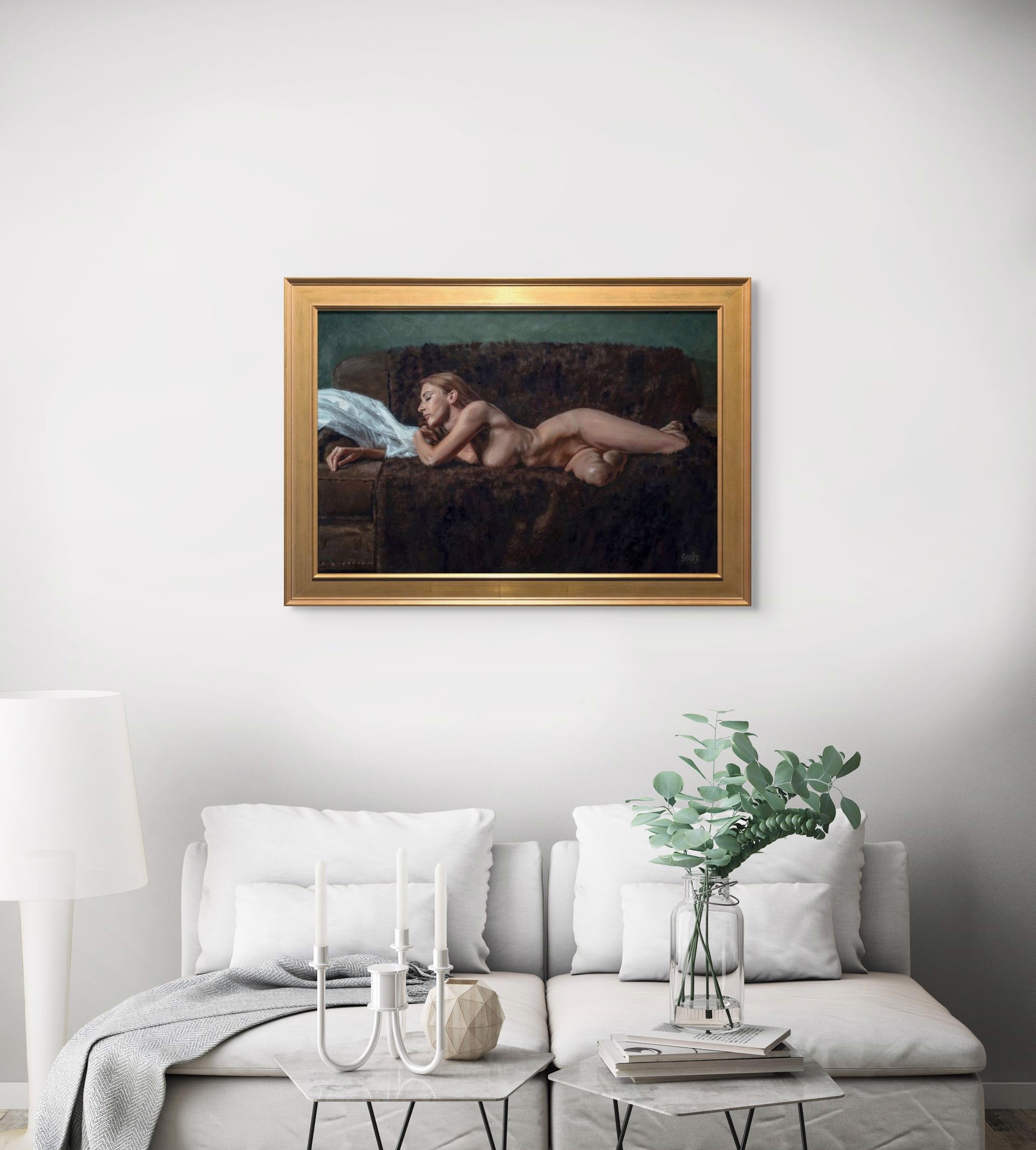 A nude figure rests on a dark sofa with a white sheet nearby.