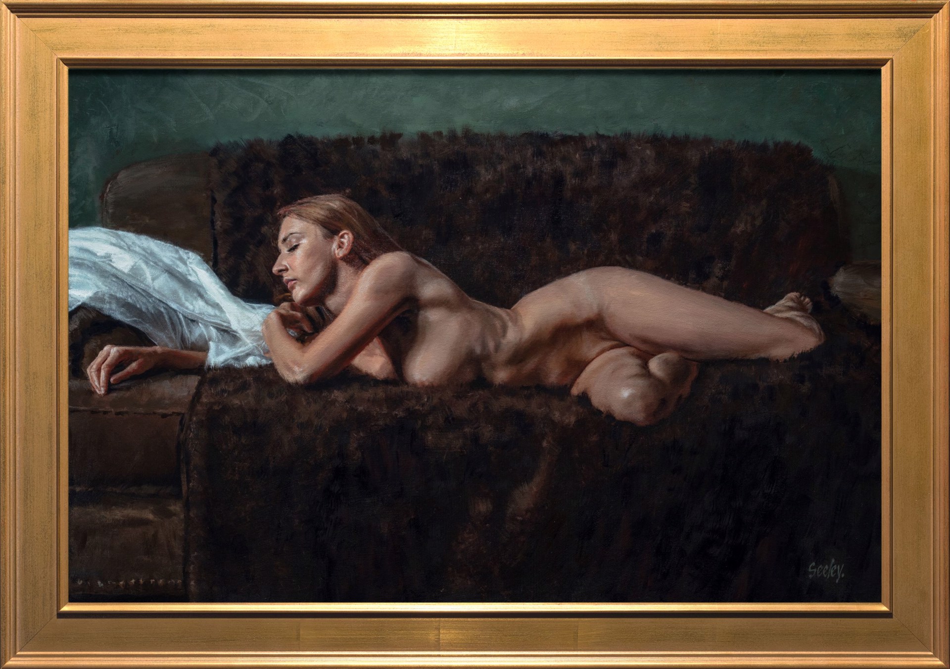A nude figure rests on a dark sofa with a white sheet nearby.