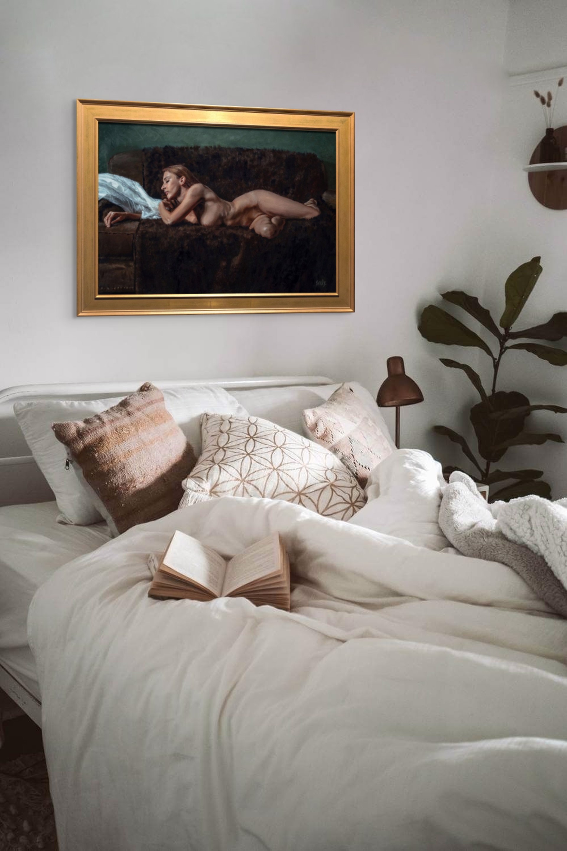 A nude figure rests on a dark sofa with a white sheet nearby.