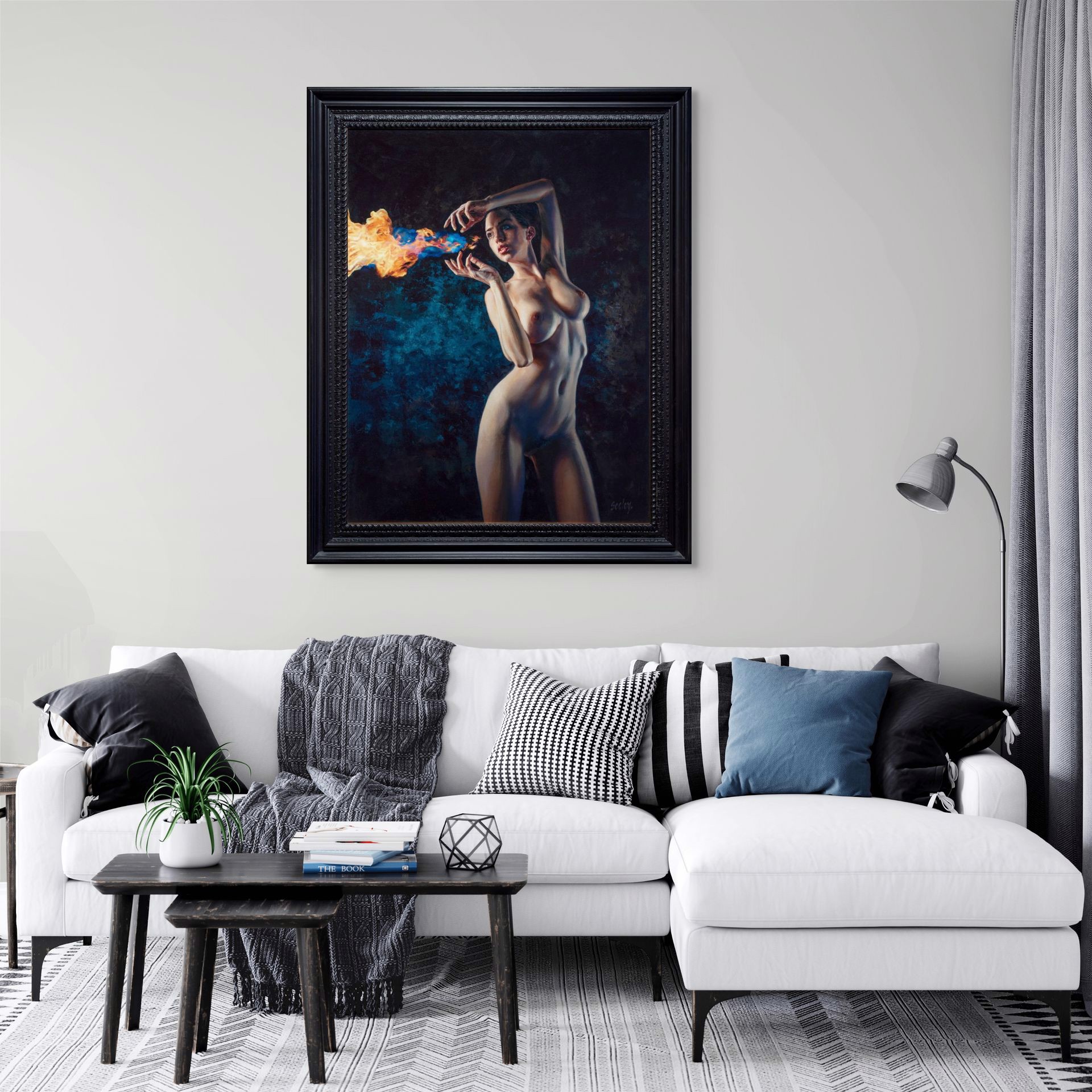 A nude figure stands in a dramatic pose, holding a stream of blue and orange flames.