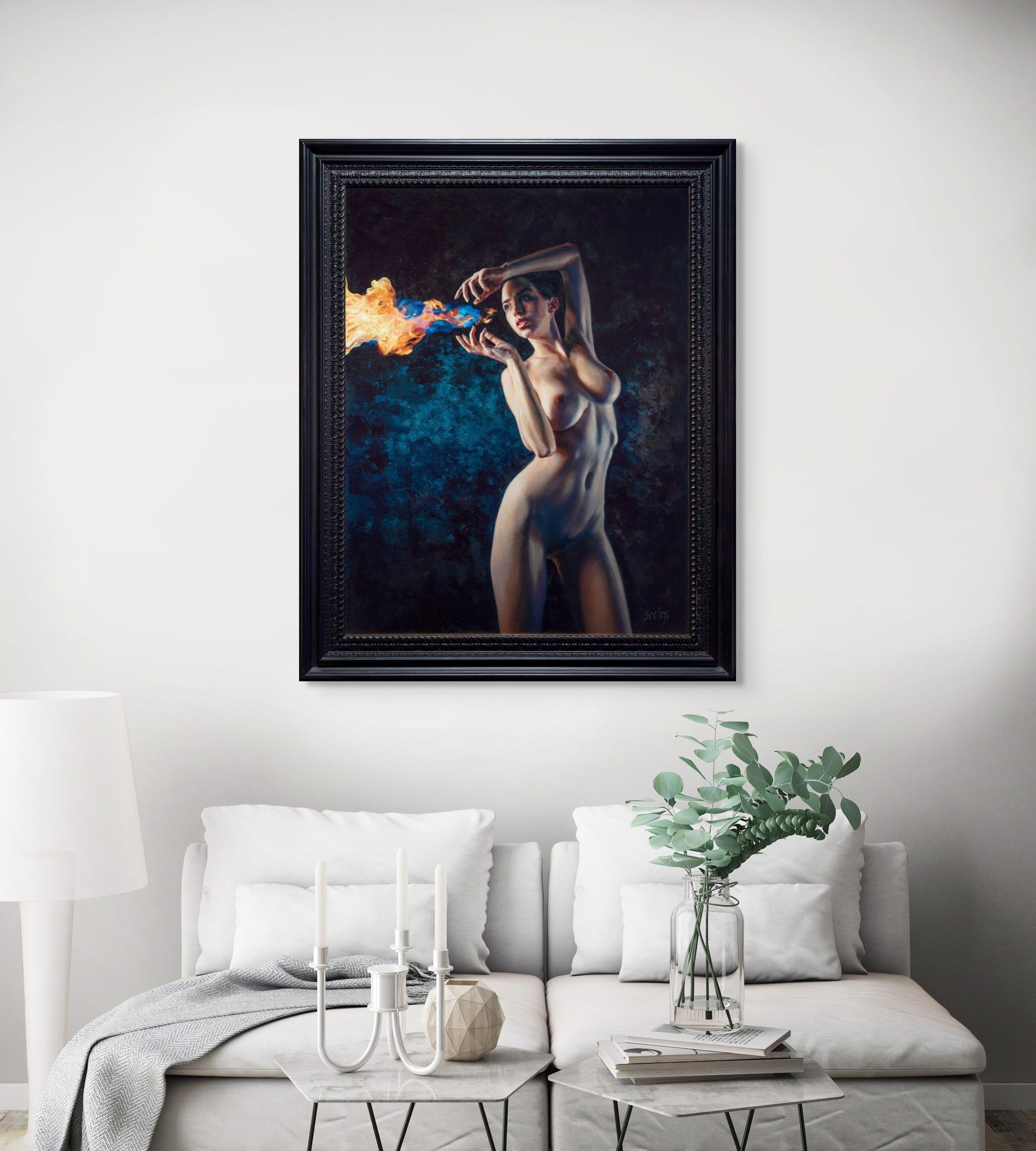 A nude figure stands in a dramatic pose, holding a stream of blue and orange flames.
