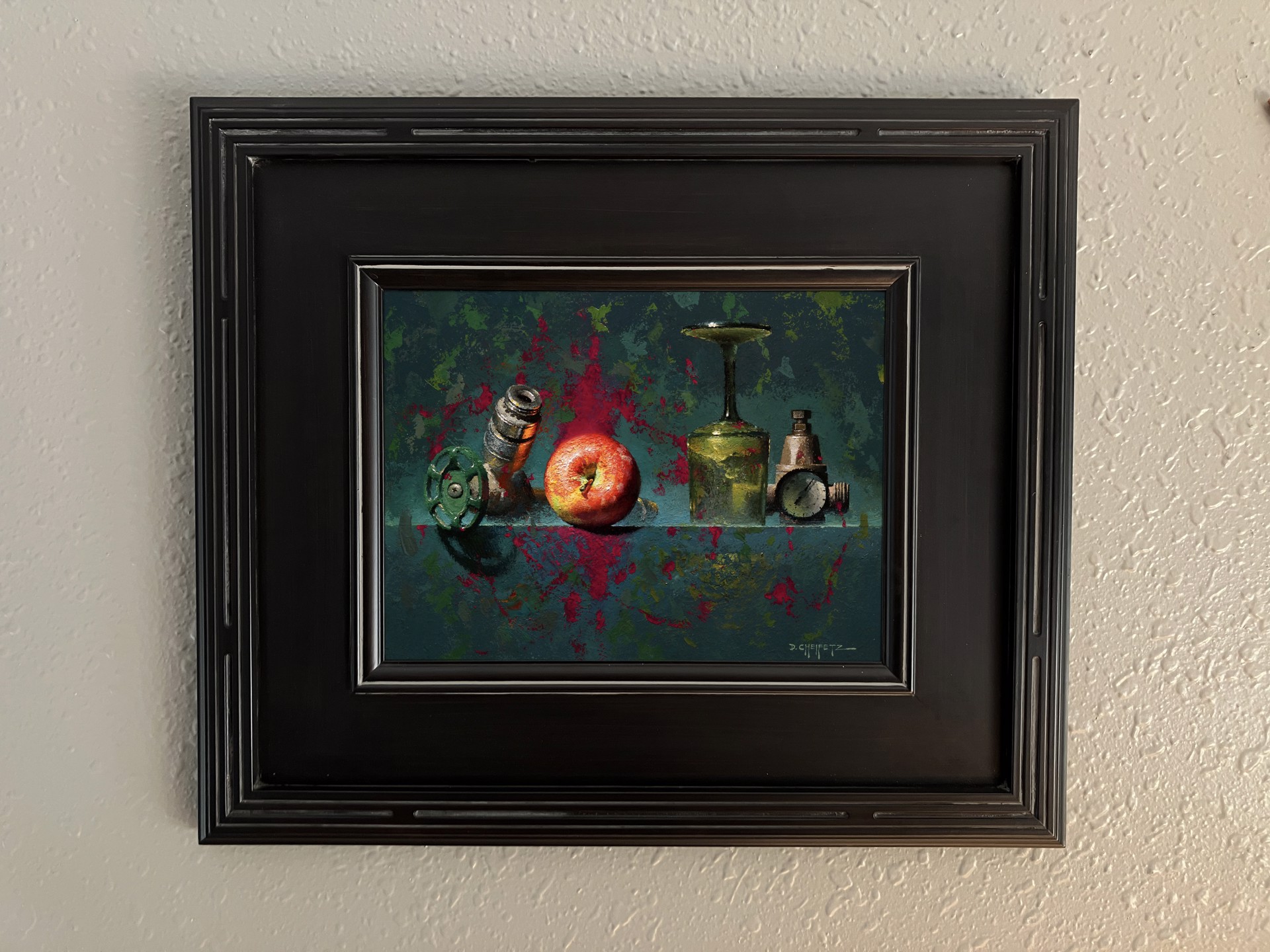 A still life painting featuring industrial and organic objects arranged on a reflective surface.