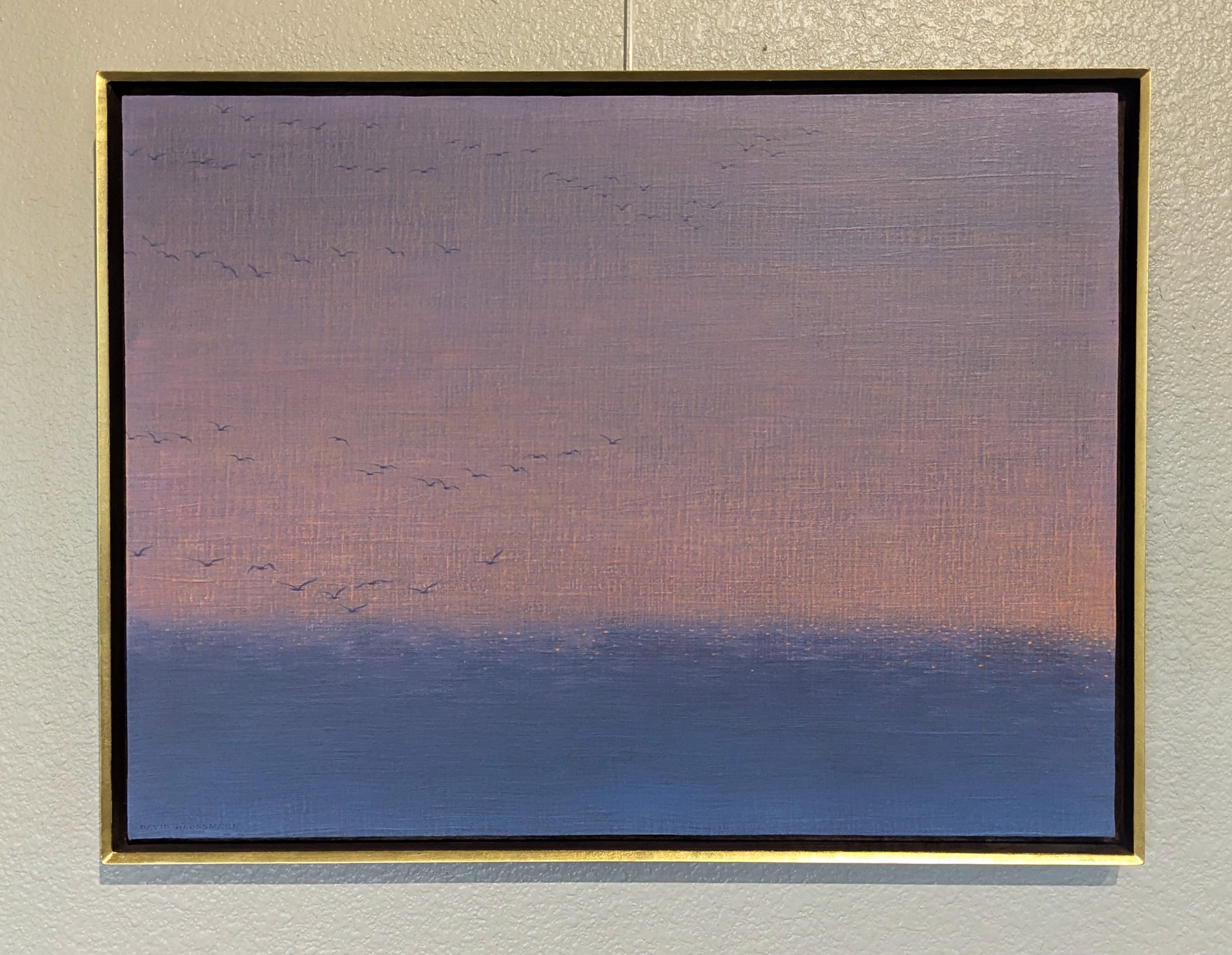 A serene seascape painting featuring a flock of birds against a soft, pastel sky.