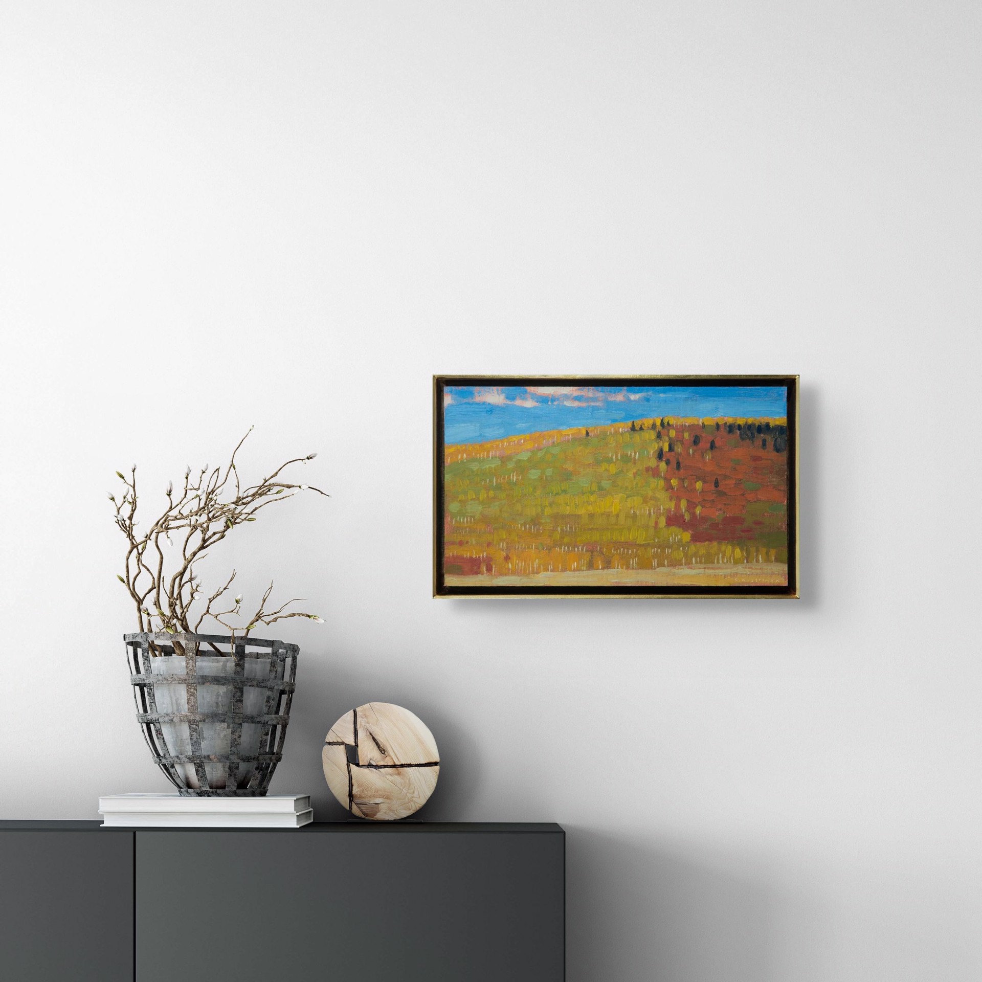 A textured landscape painting of a rolling hill under a blue sky.