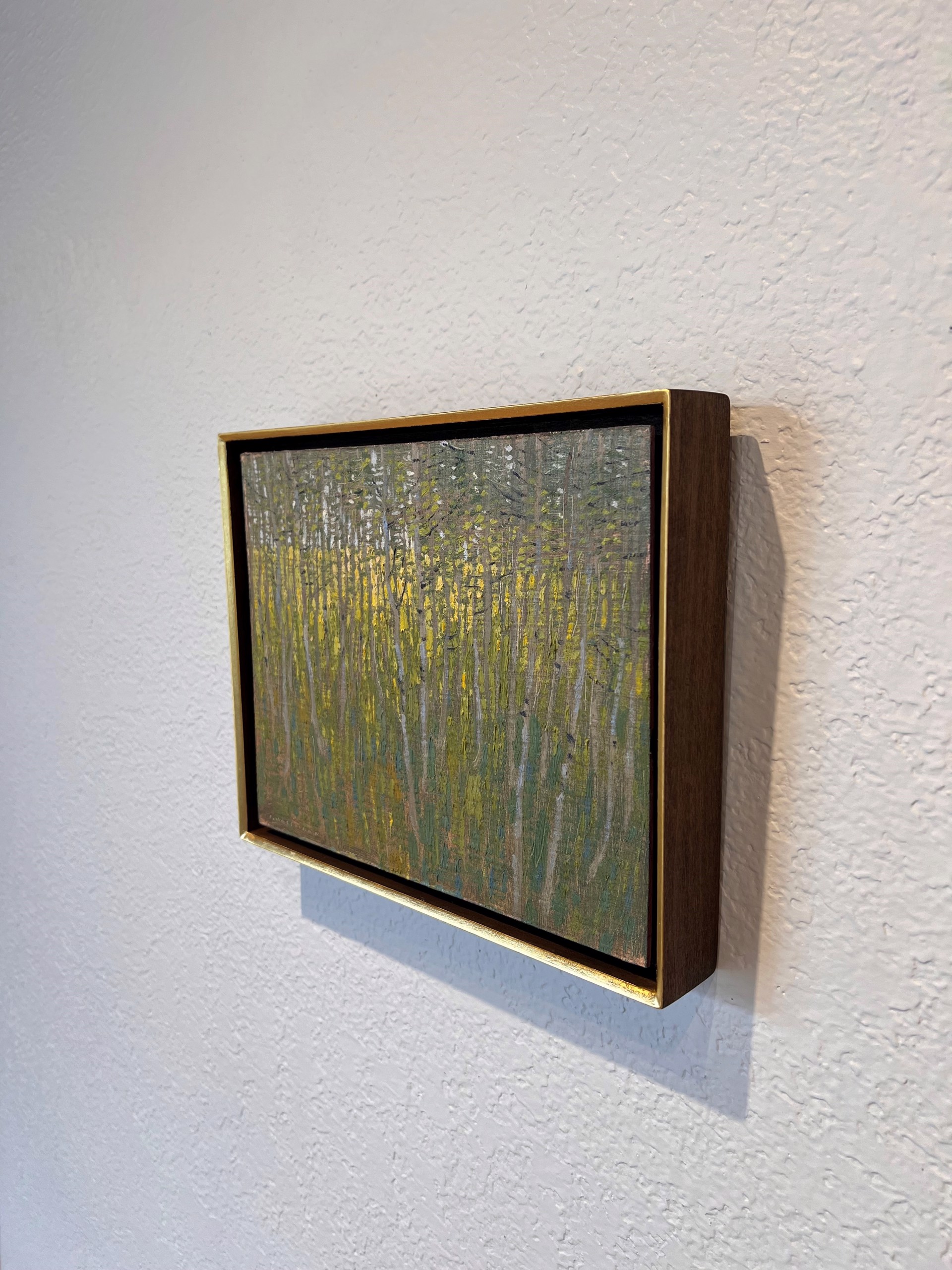 A painting of a forest with trees in the background.