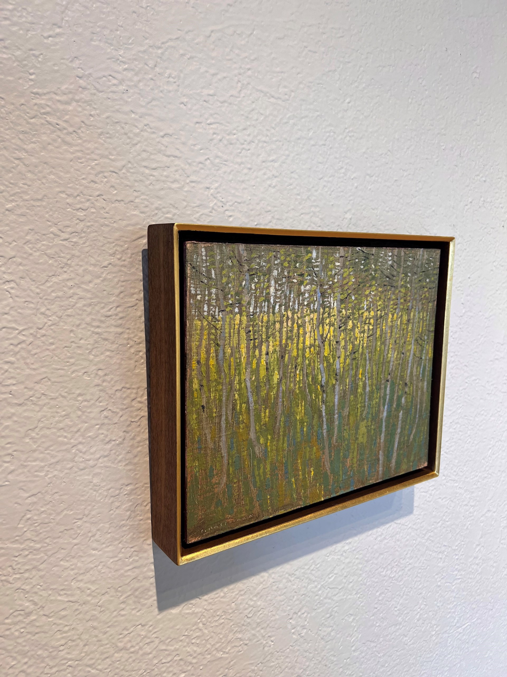 A painting of a forest with trees in the background.