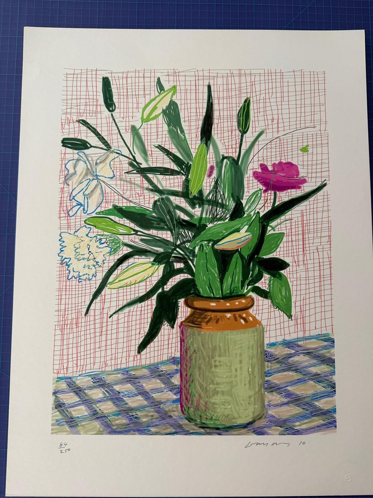 A vibrant still life of a colorful bouquet in a jar against a grid background.