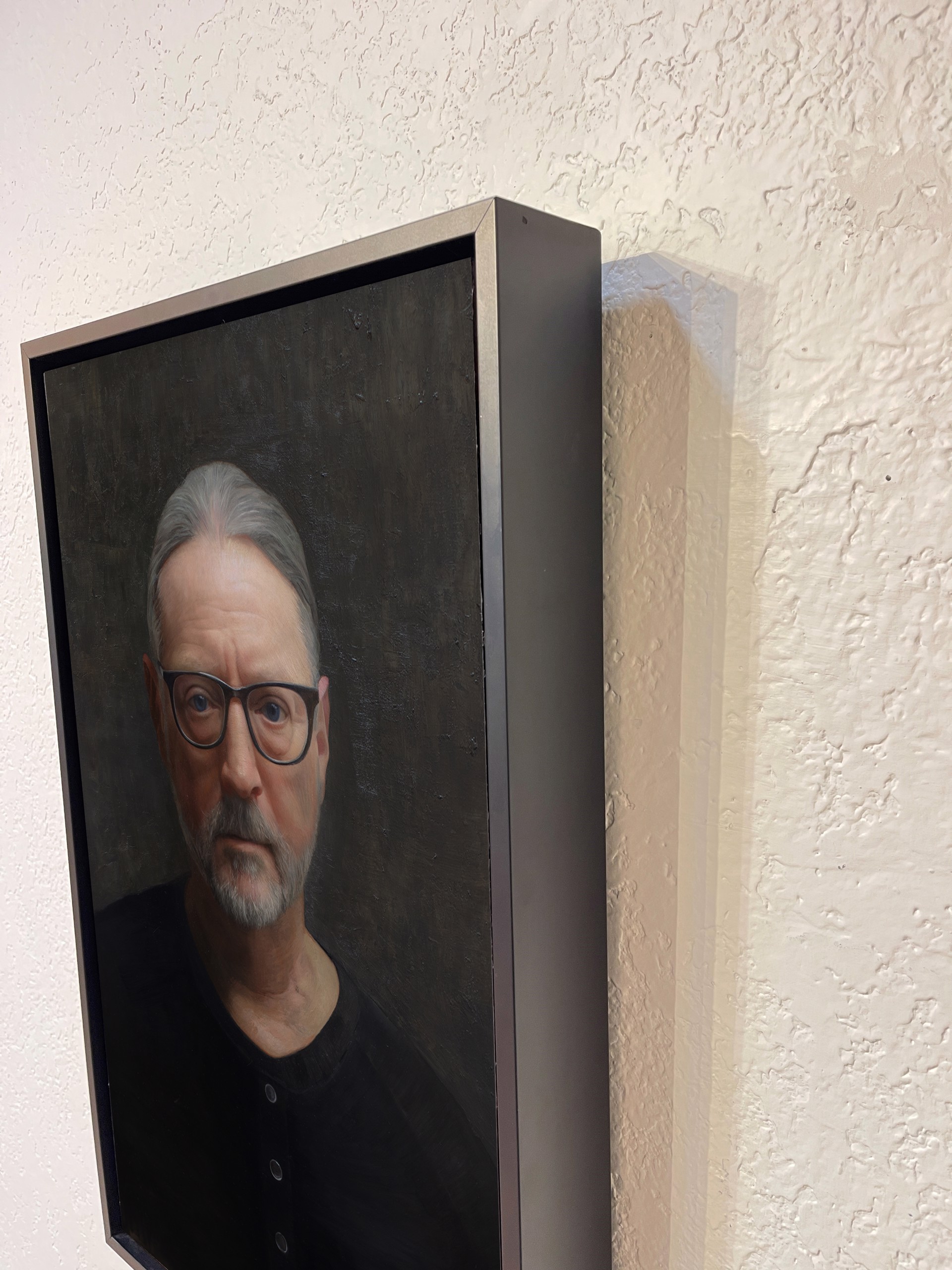 A painting of a man with glasses and a beard.