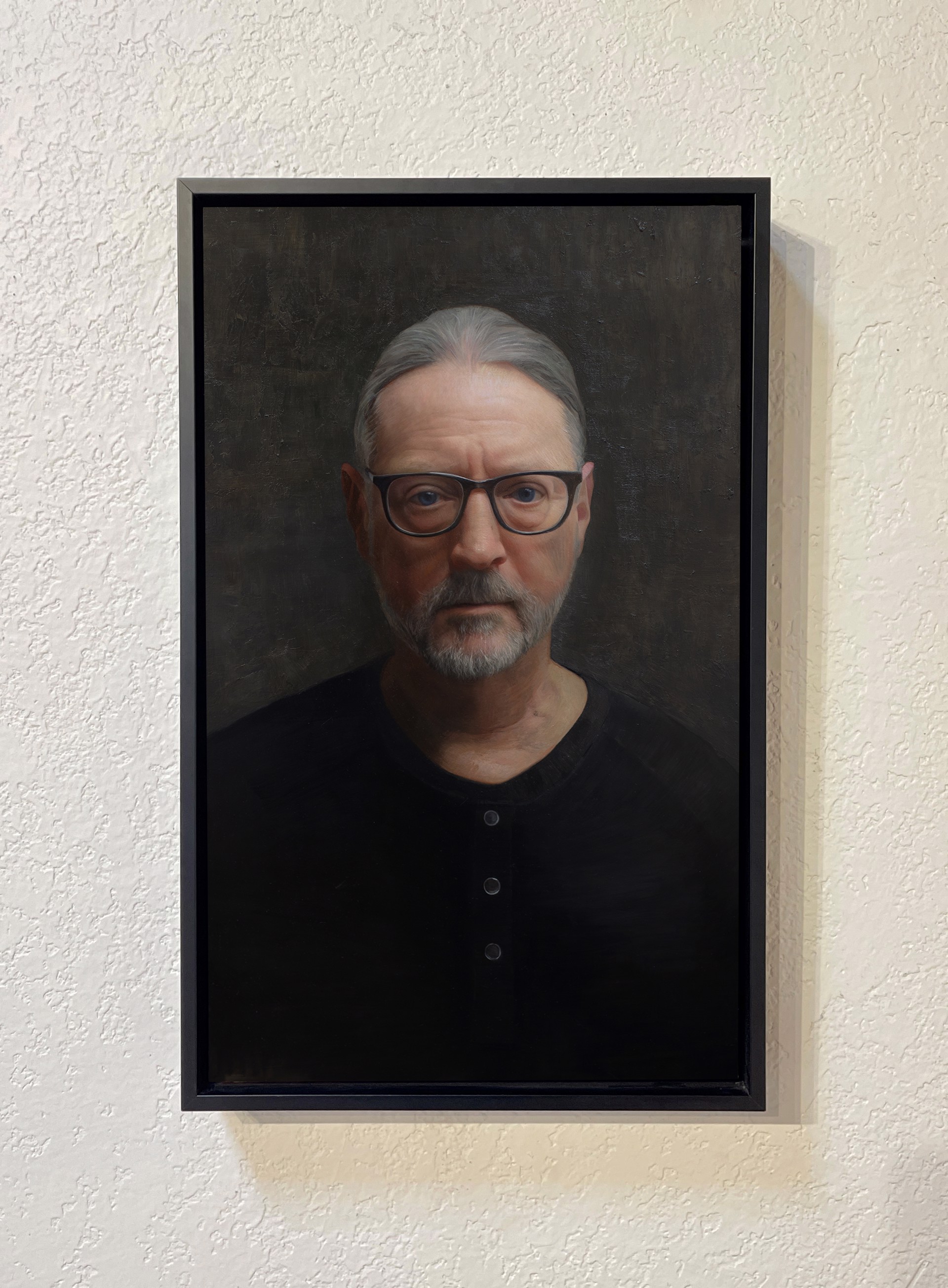 A painting of a man with glasses and a beard.