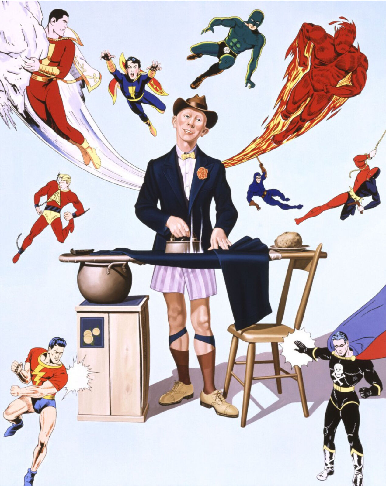 A man in a suit and hat standing in front of a table with a bunch of superheros.