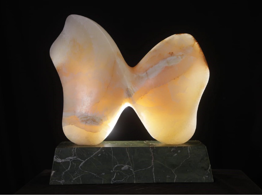A lamp that is sitting on top of a marble base.