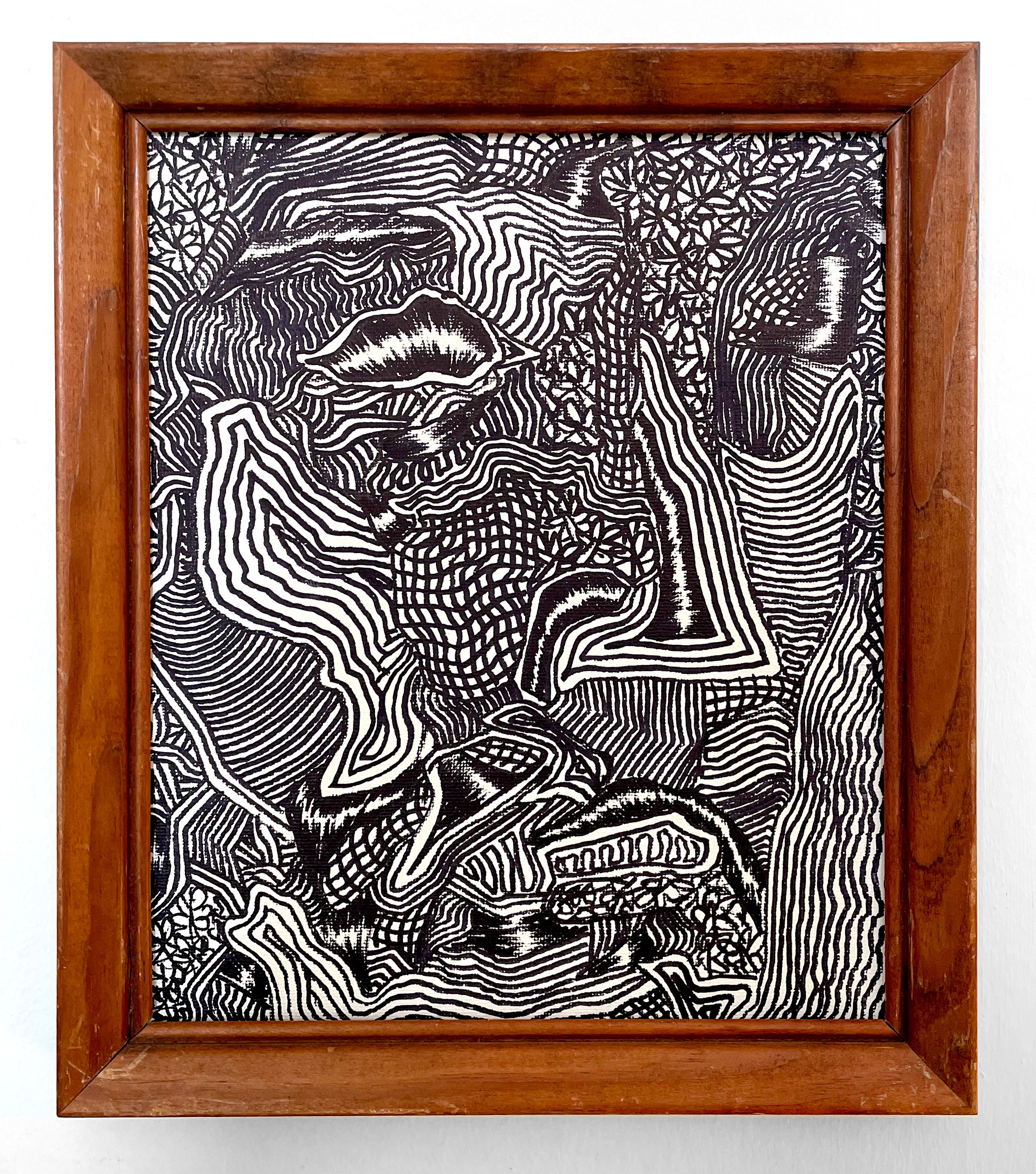 A black and white drawing hanging on a wall.