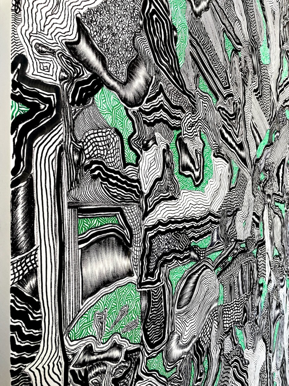 A black and white drawing of a green and black pattern.
