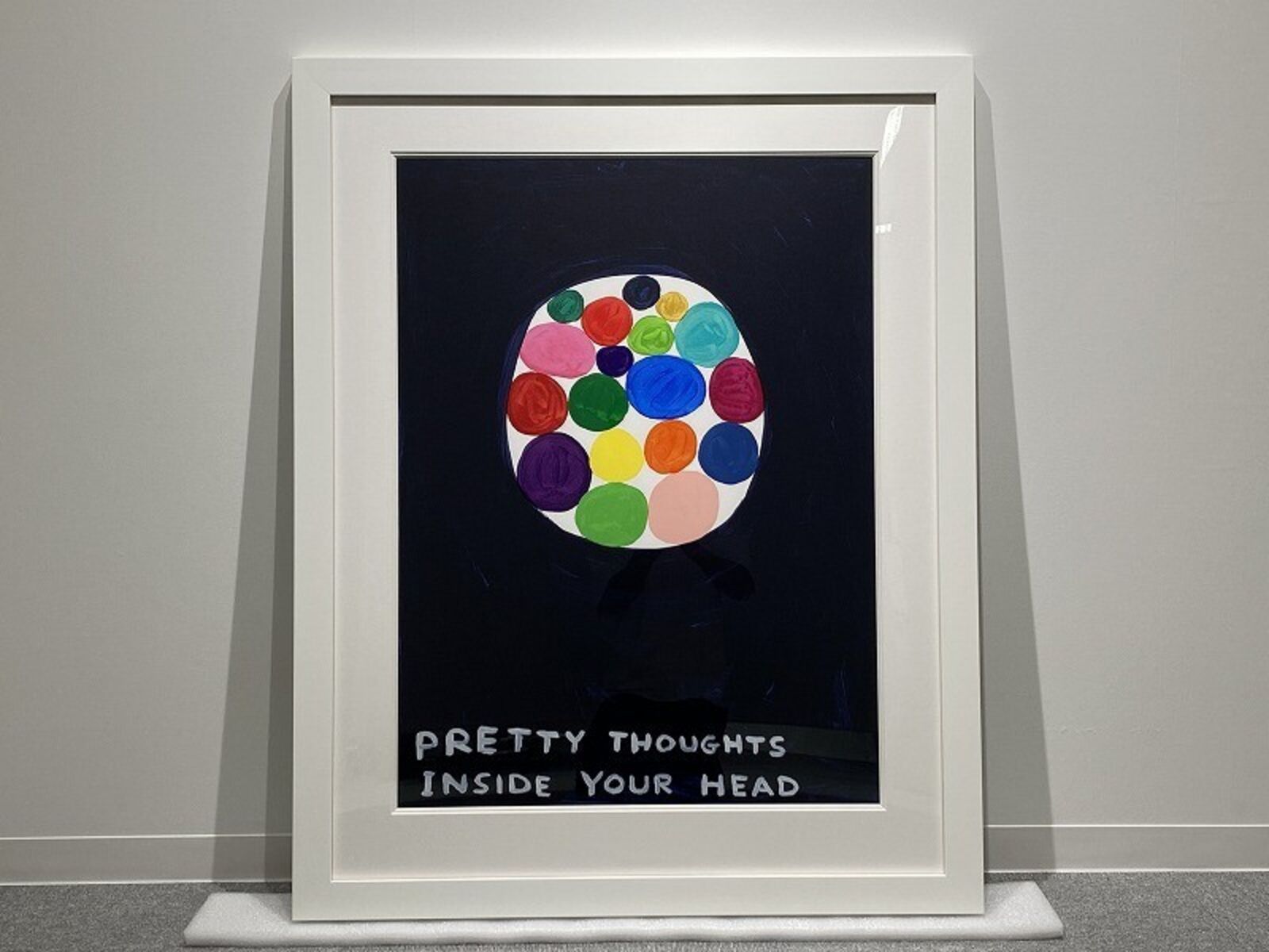 A picture of a painting with the words pretty thoughts inside your head.