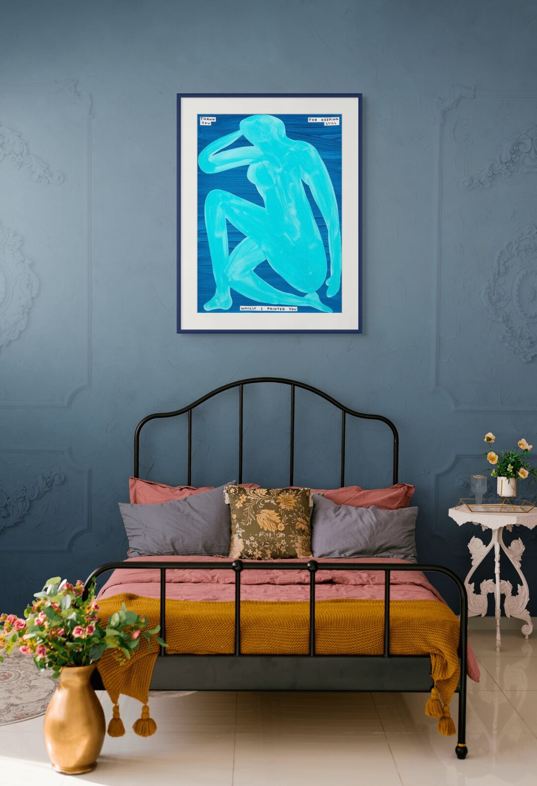 A blue painting of a nude woman sitting on the ground.