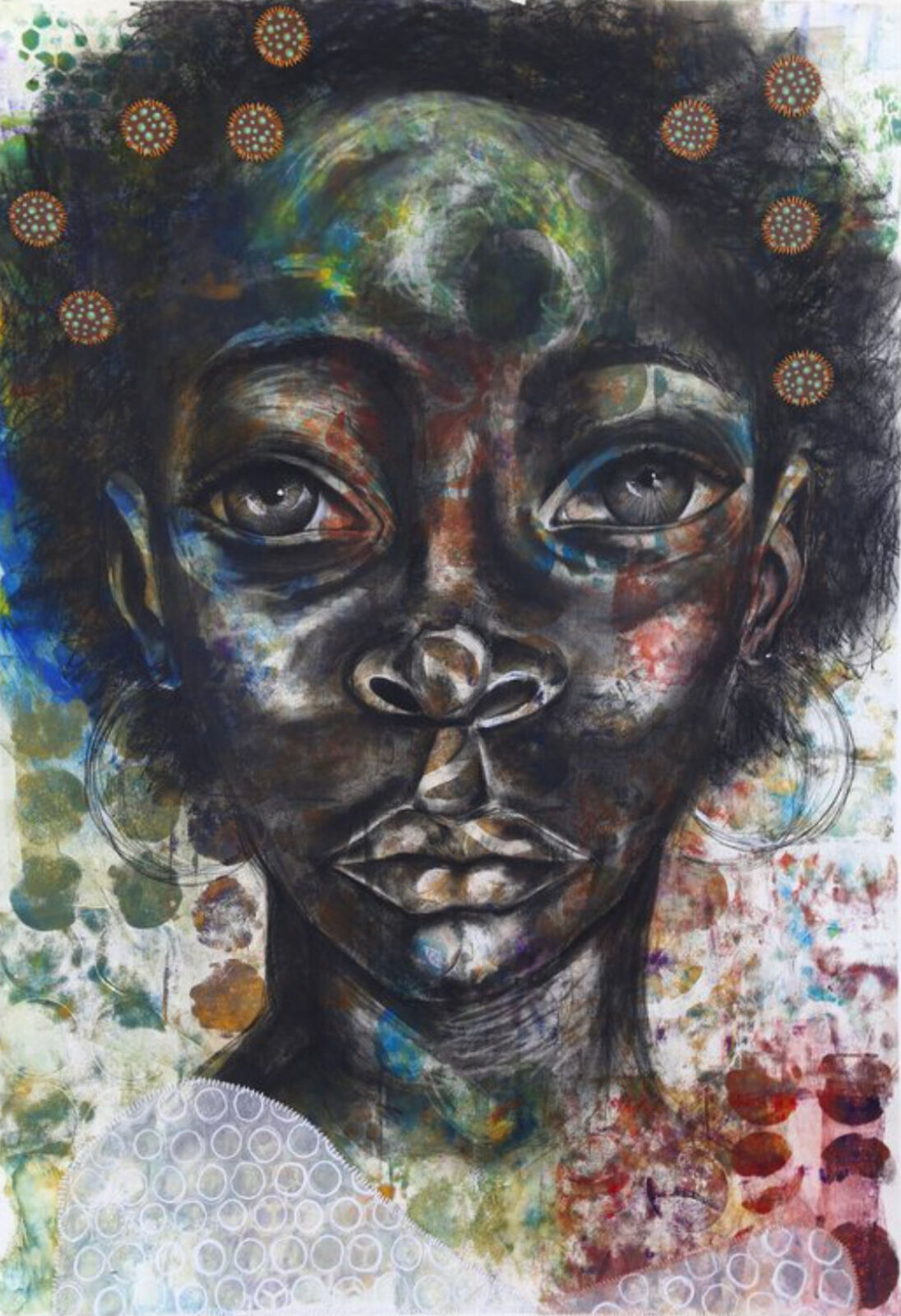 A painting of a woman's face on a piece of paper.