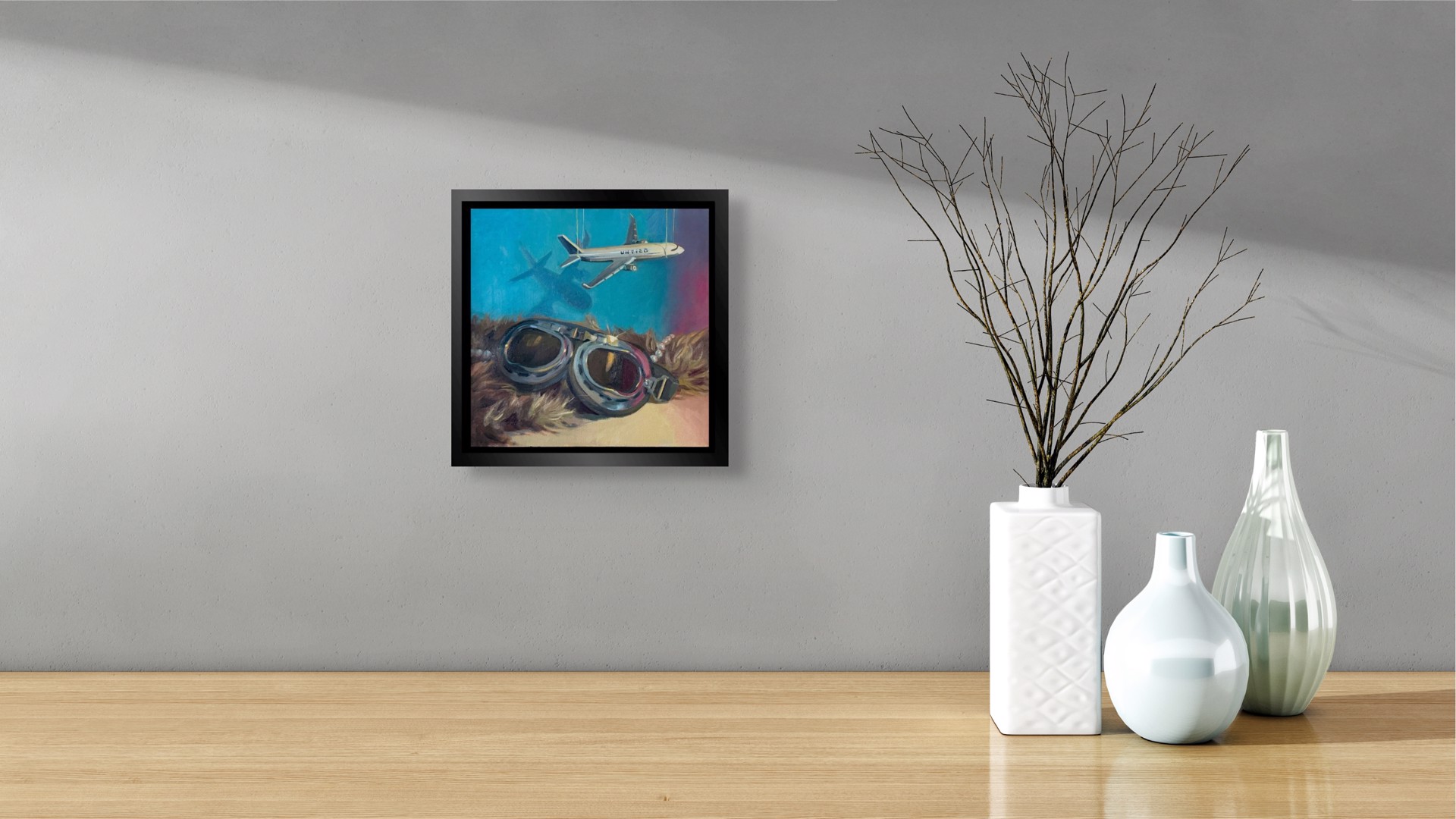 A surreal composition juxtaposing vintage aviator goggles with a suspended airplane model against a textured background.