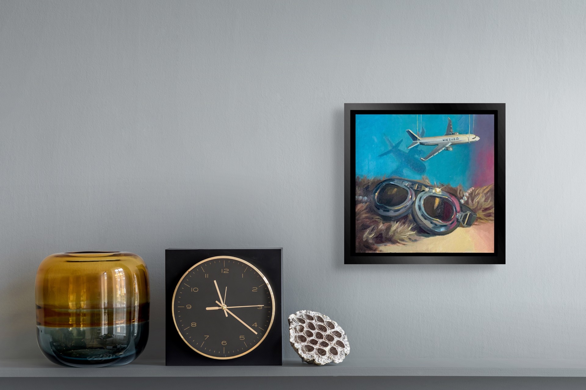 A surreal composition juxtaposing vintage aviator goggles with a suspended airplane model against a textured background.