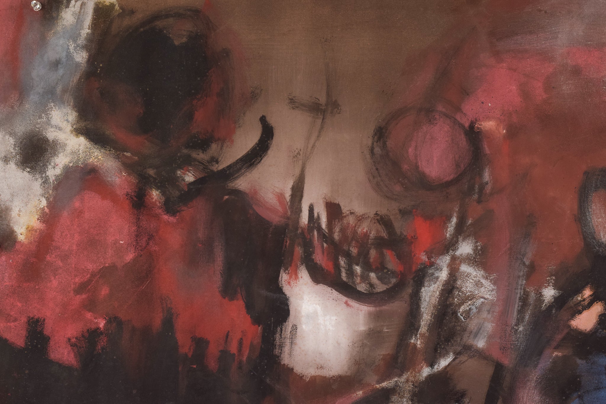 A painting of a woman's face on a piece of paper.