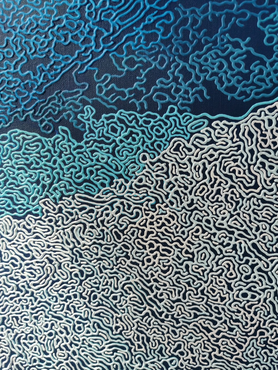 A blue and white abstract background with a pattern of clouds.