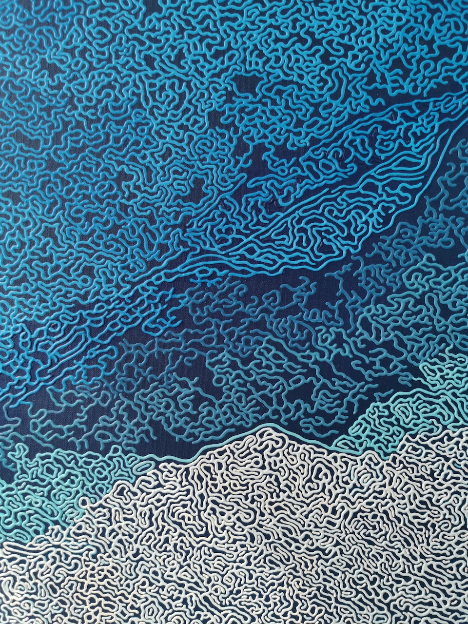 A blue and white abstract background with a pattern of clouds.