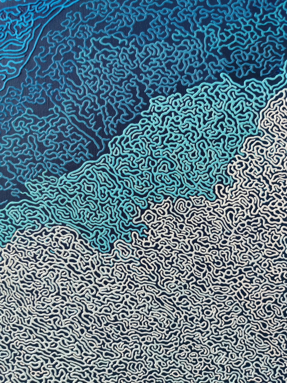 A blue and white abstract background with a pattern of clouds.