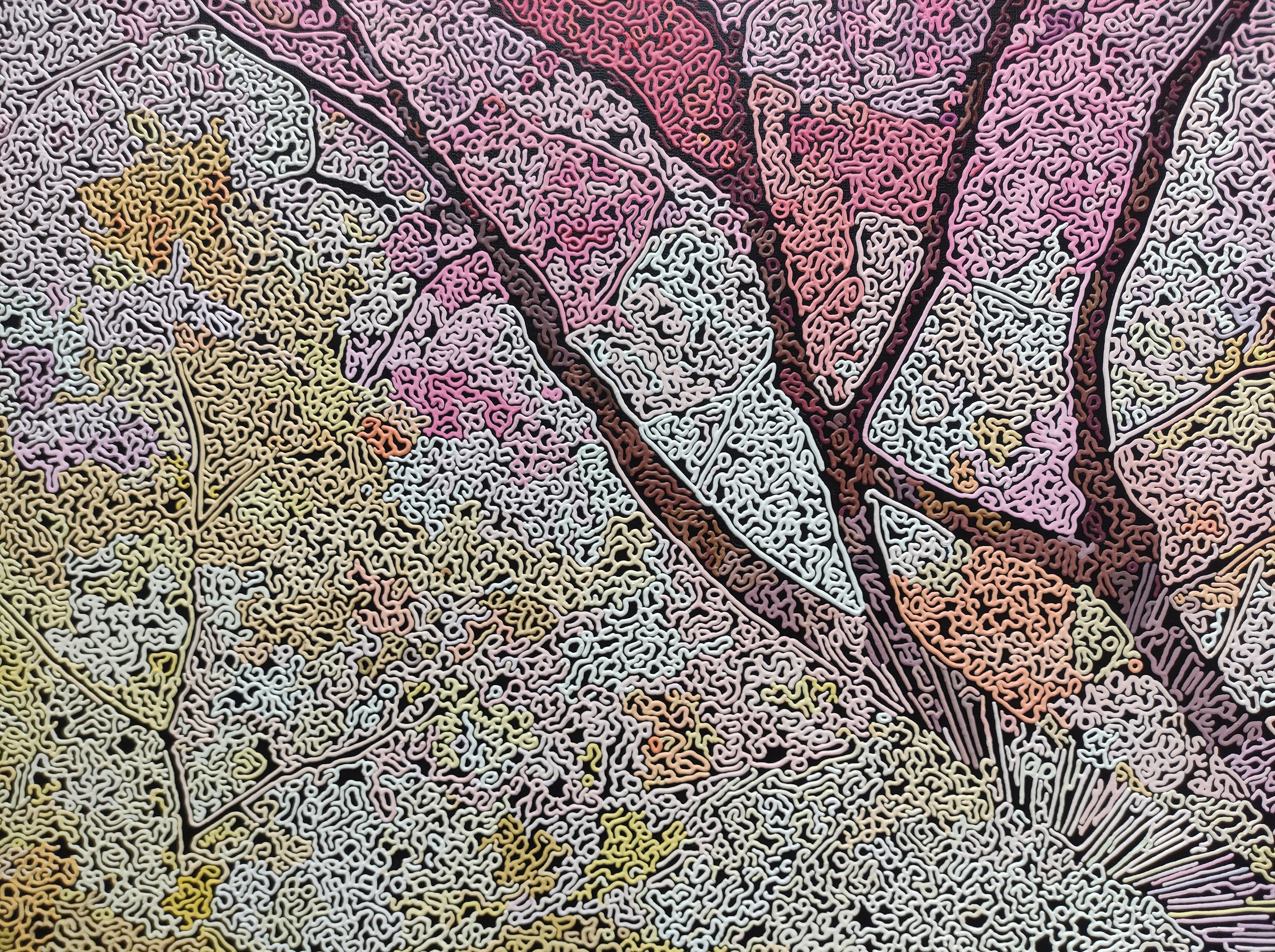A painting of a tree on a wall in a room.