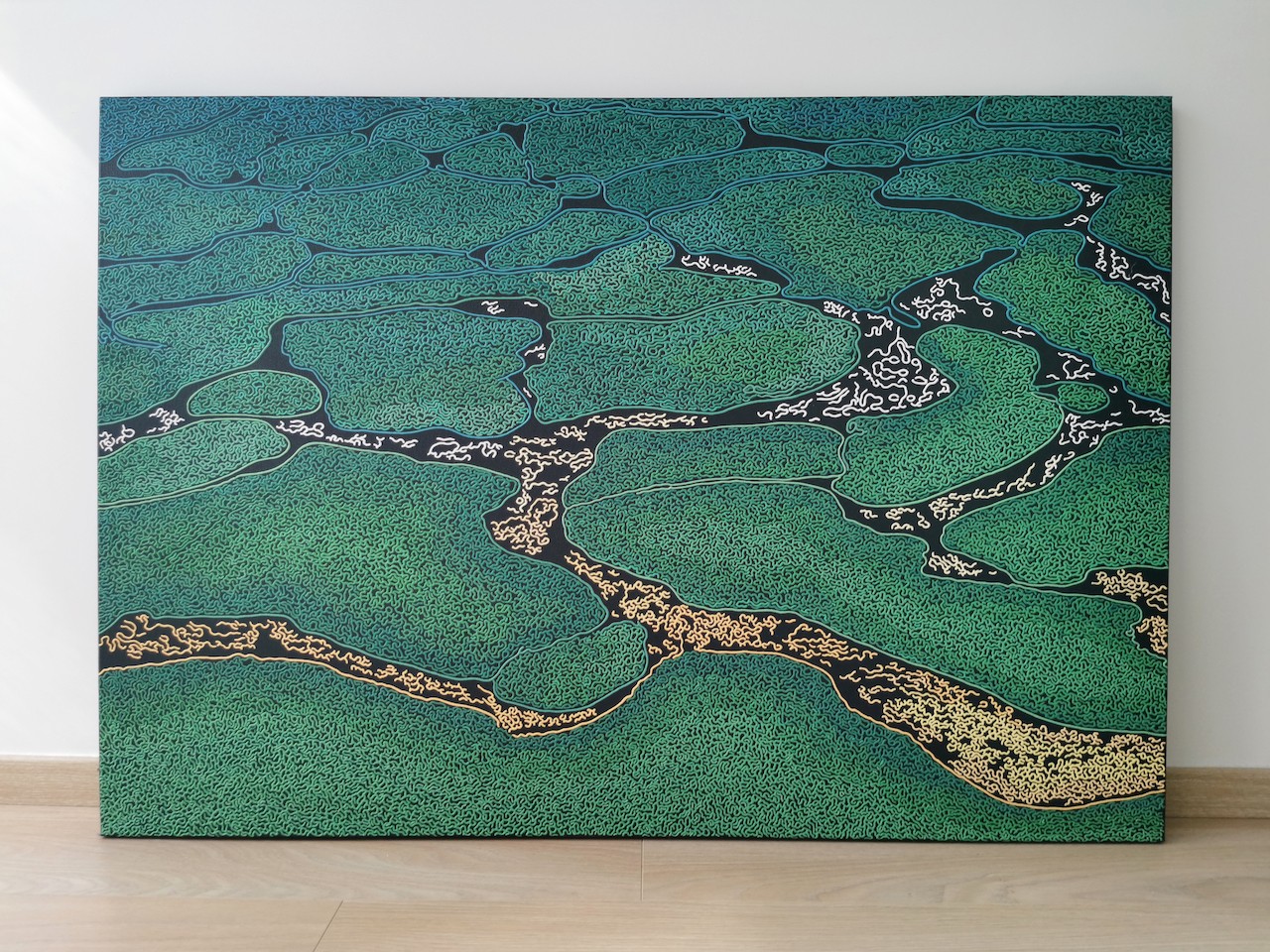 A large painting on a wall in a room.