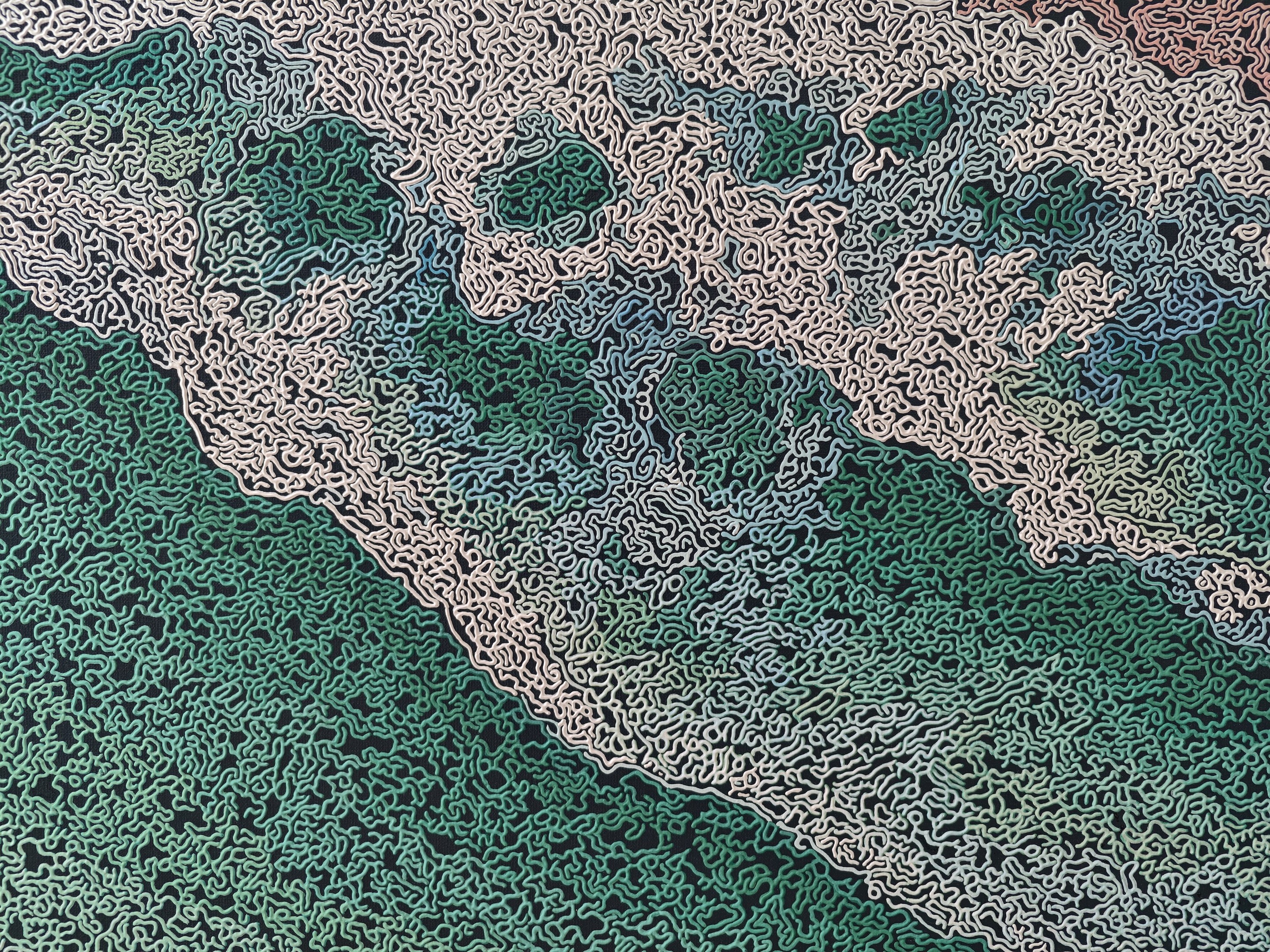 A rug on a wooden floor with a painting on it.