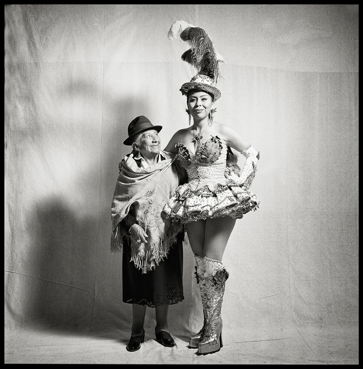A man and a woman dressed in costumes posing for a picture.