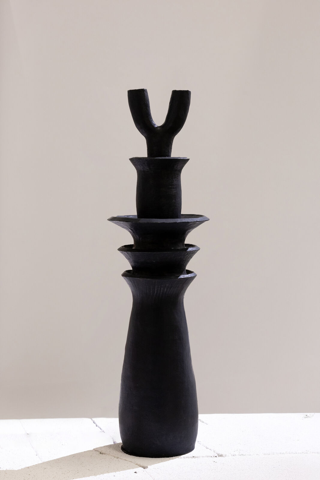 Artwork by Dina Nur Satti, Tower Lotus II, Made of Red sculpture clay, black glaze 