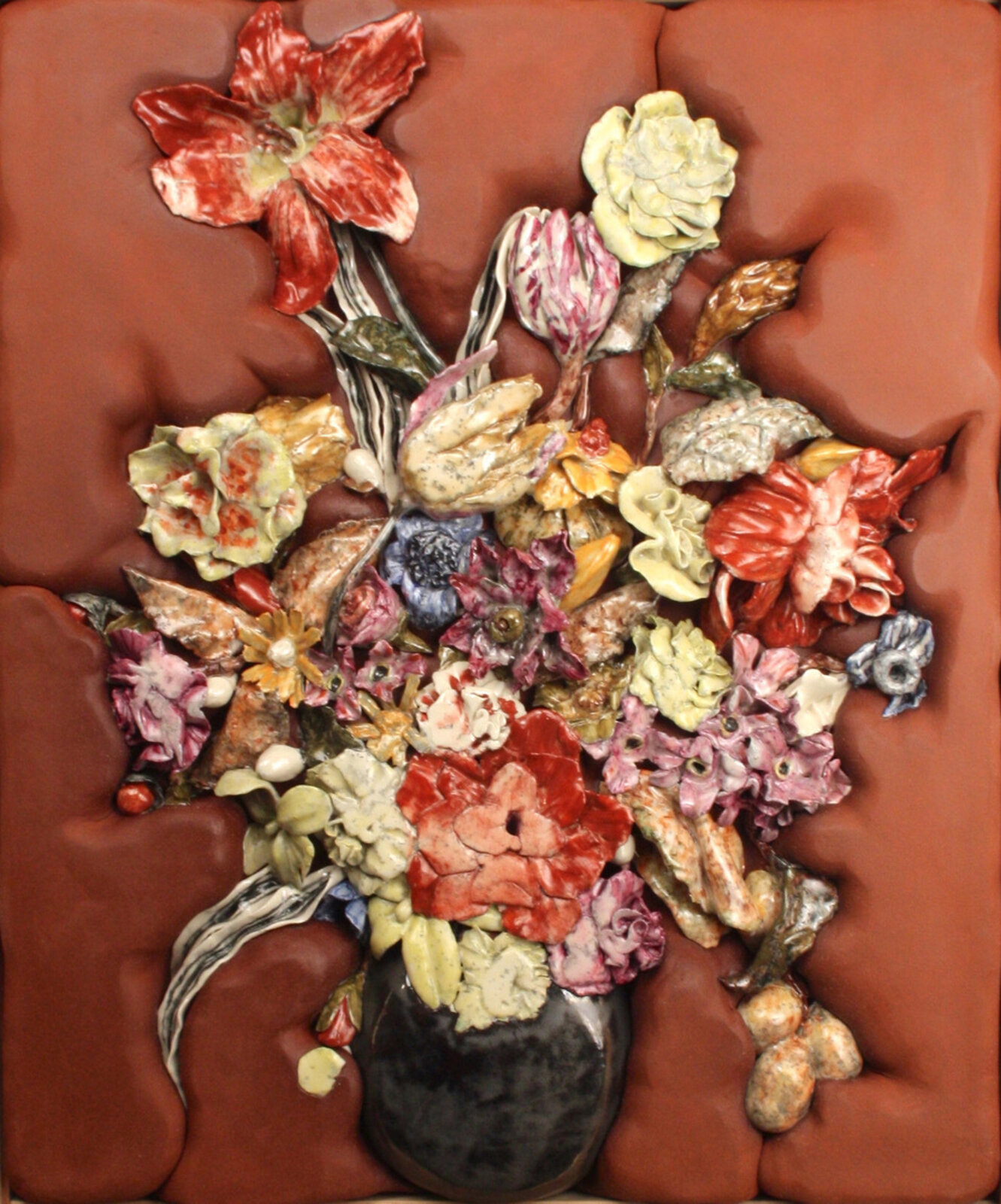 A richly textured still life featuring a bouquet of ceramic flowers in a dark vase against a tufted brown background.