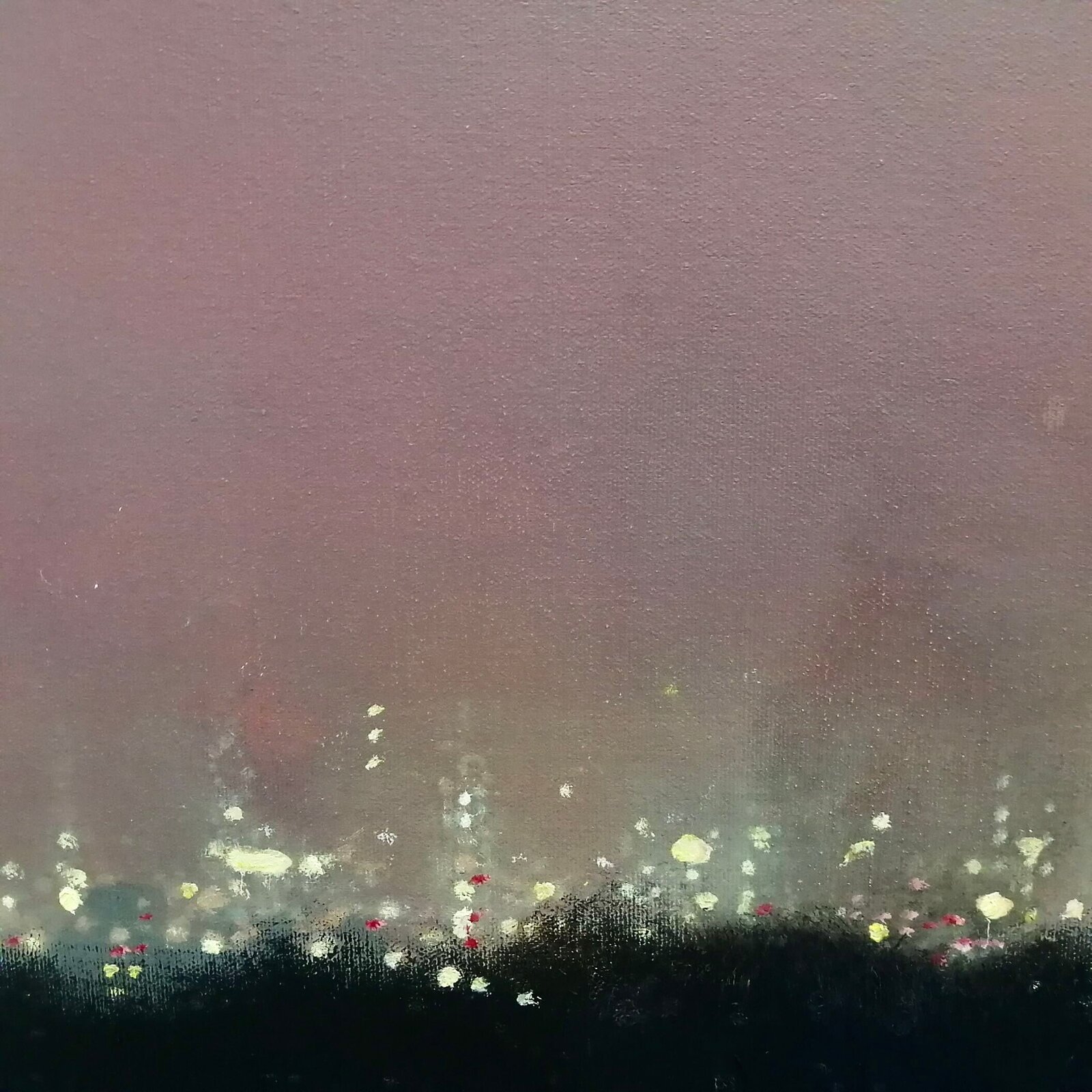 A moody night cityscape under a hazy, pink-hued sky with a bright celestial body.