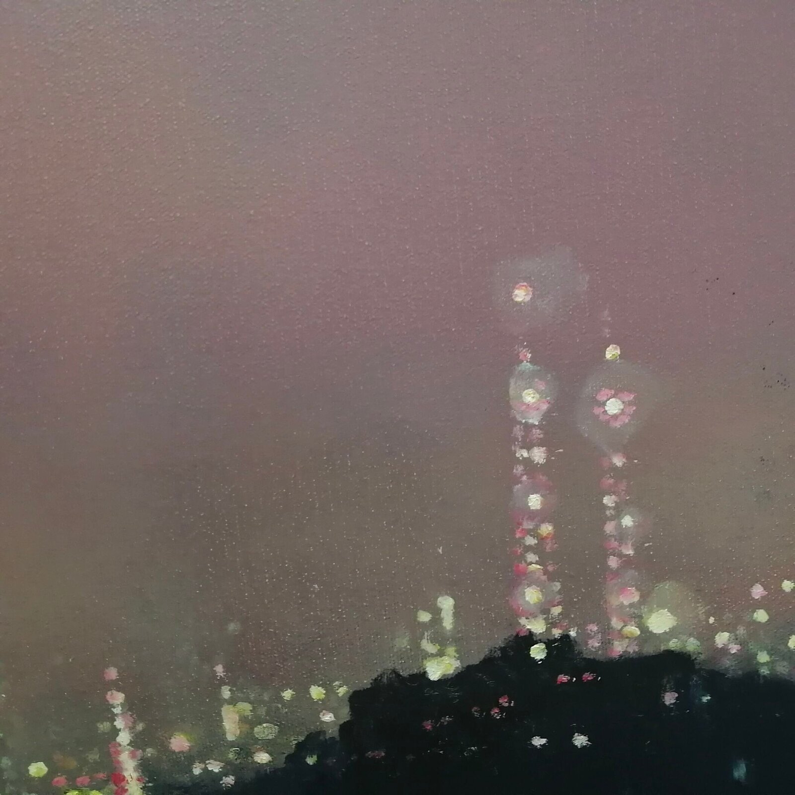 A moody night cityscape under a hazy, pink-hued sky with a bright celestial body.
