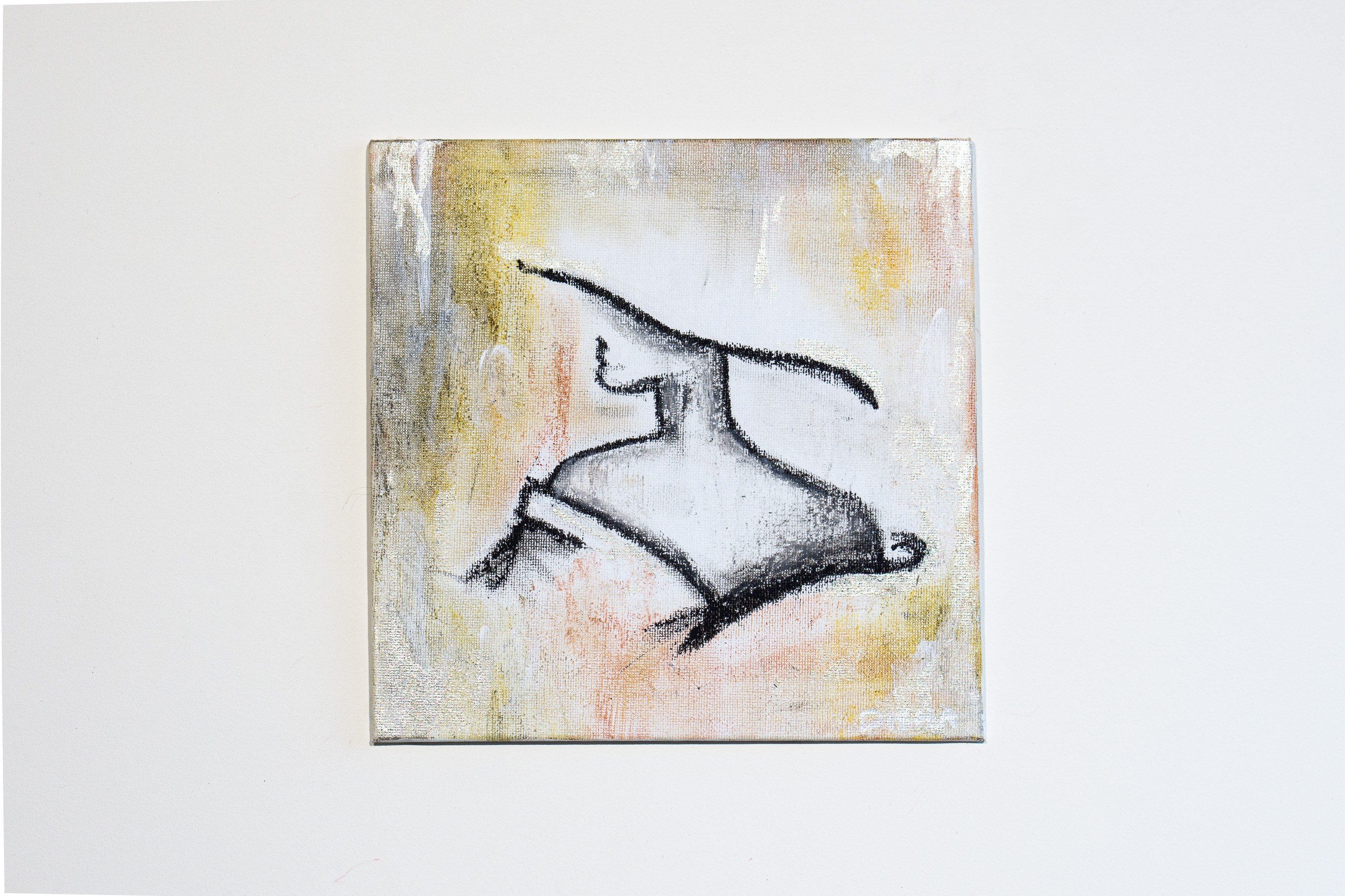 A painting of a rabbit on a white wall. 