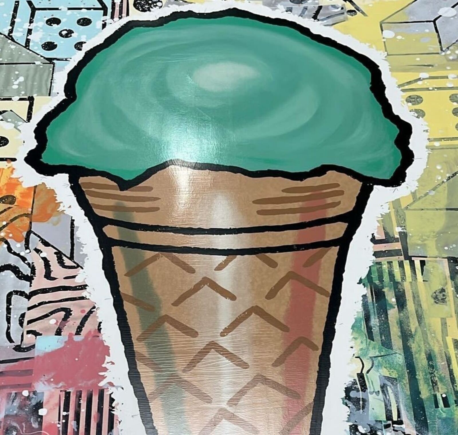 A painting of an ice cream cone on a wall.