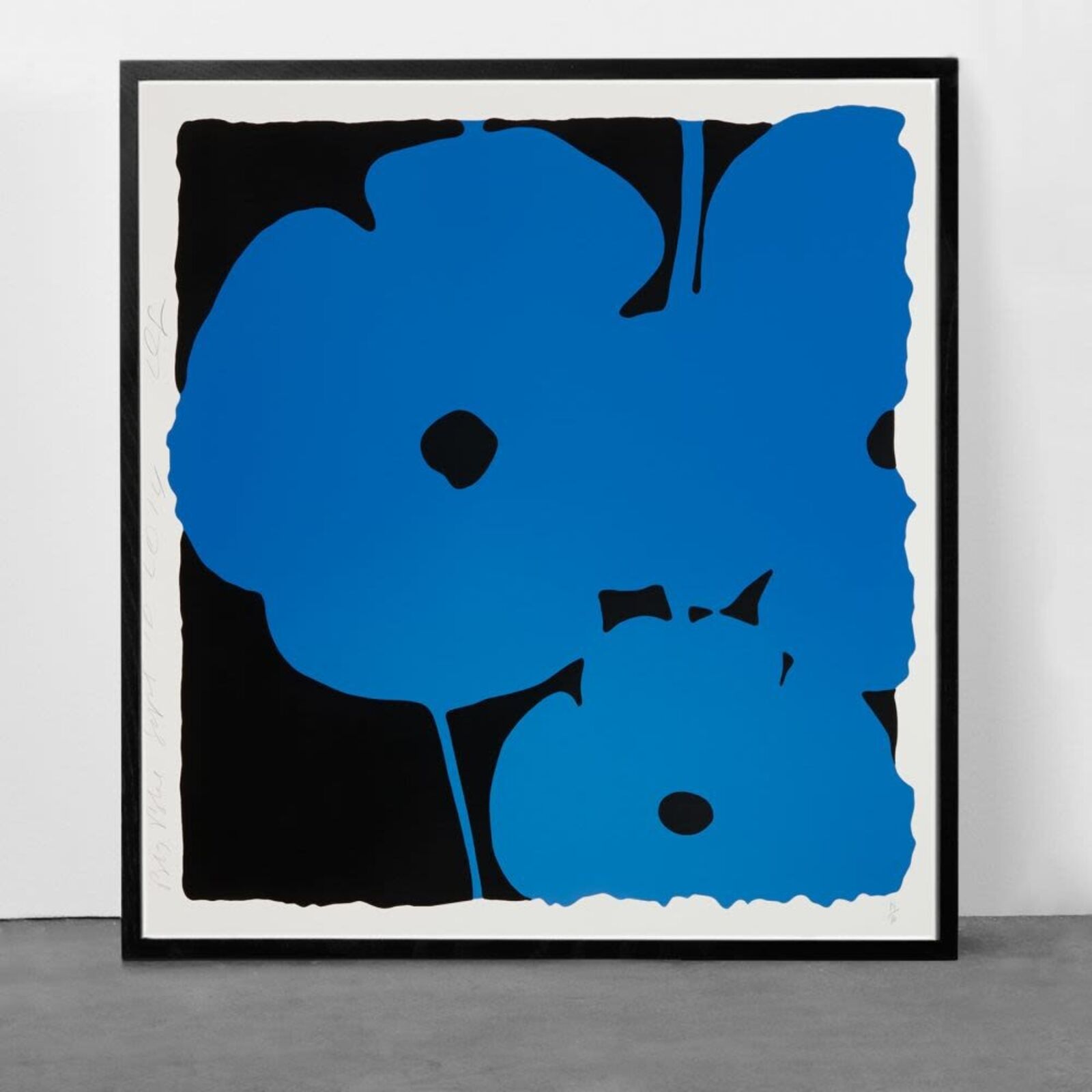 A blue and black painting on a white wall.