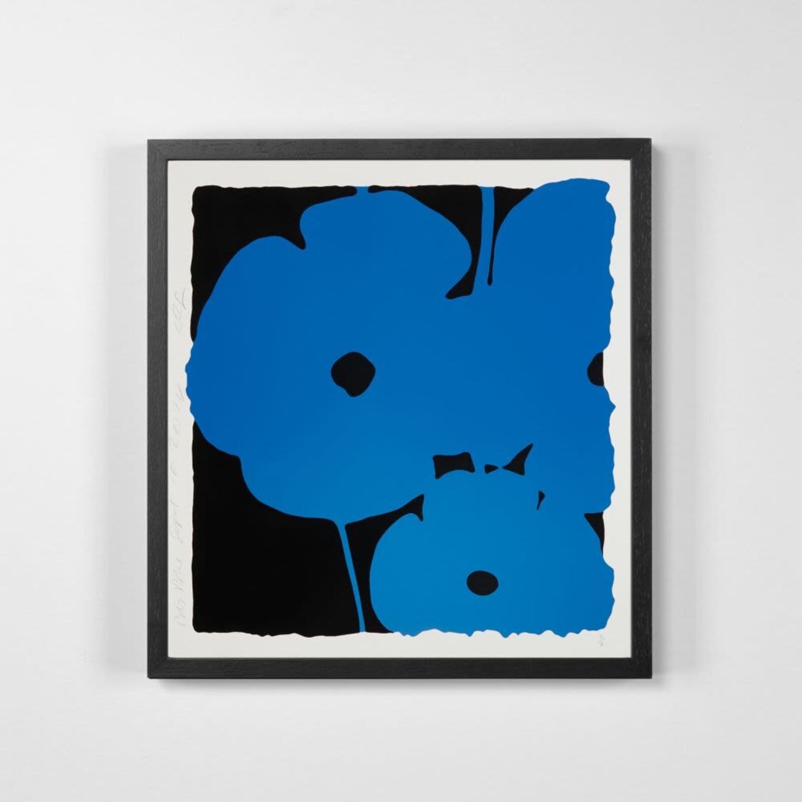 A blue and black painting on a white wall.