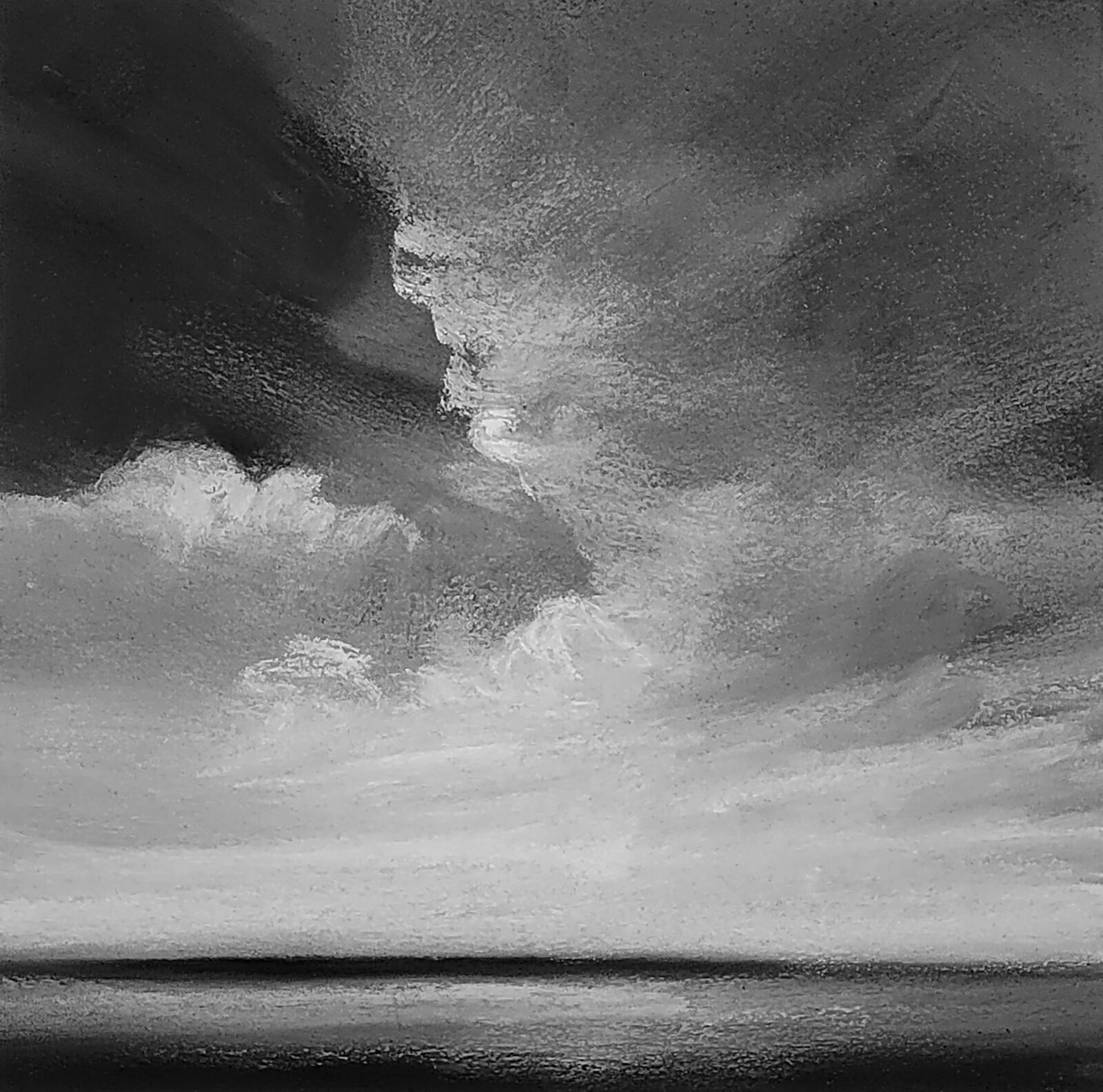 A moody monochrome seascape featuring a turbulent sky over a dark horizon.