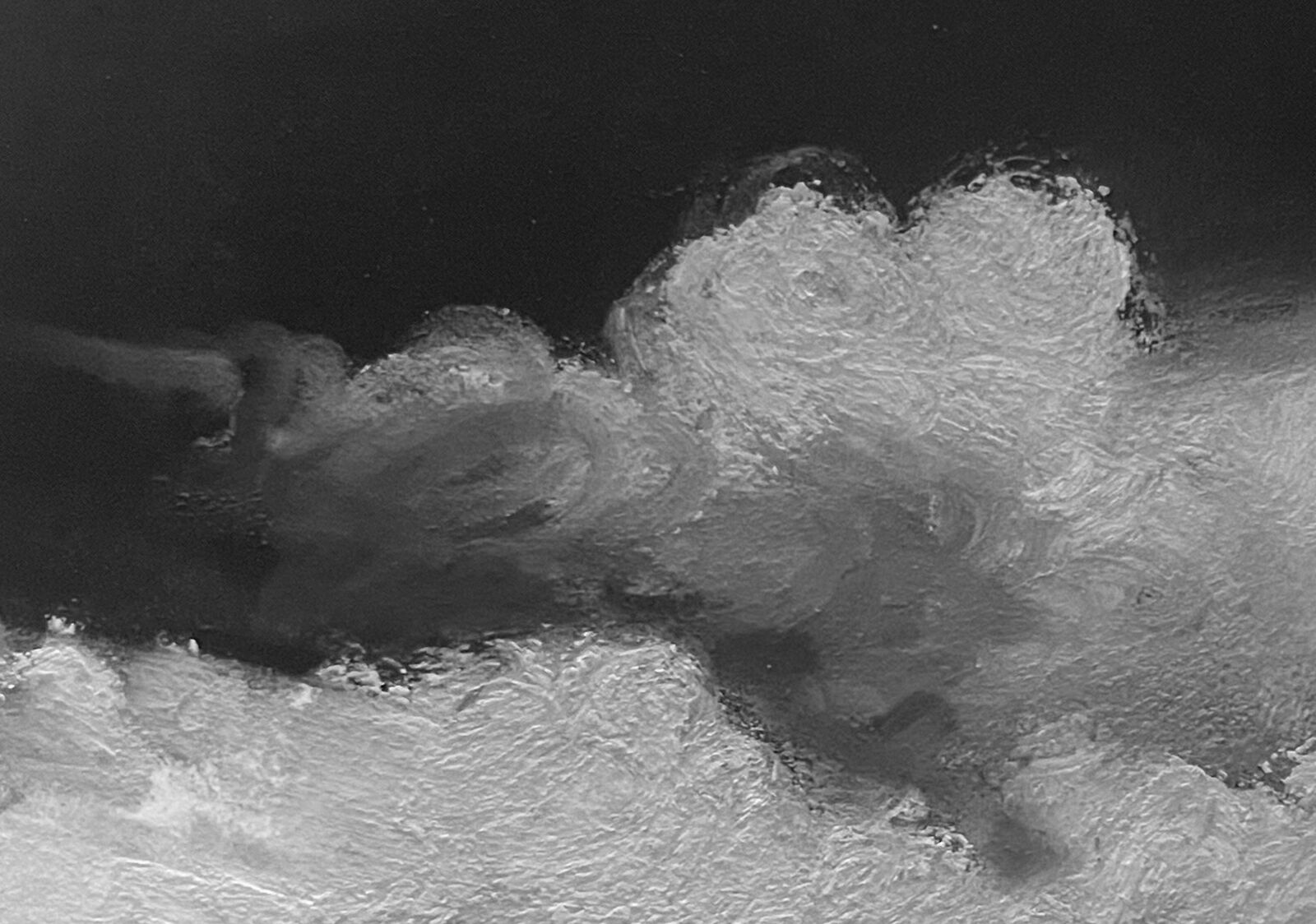 A monochromatic seascape painting featuring a turbulent sky and dark water.