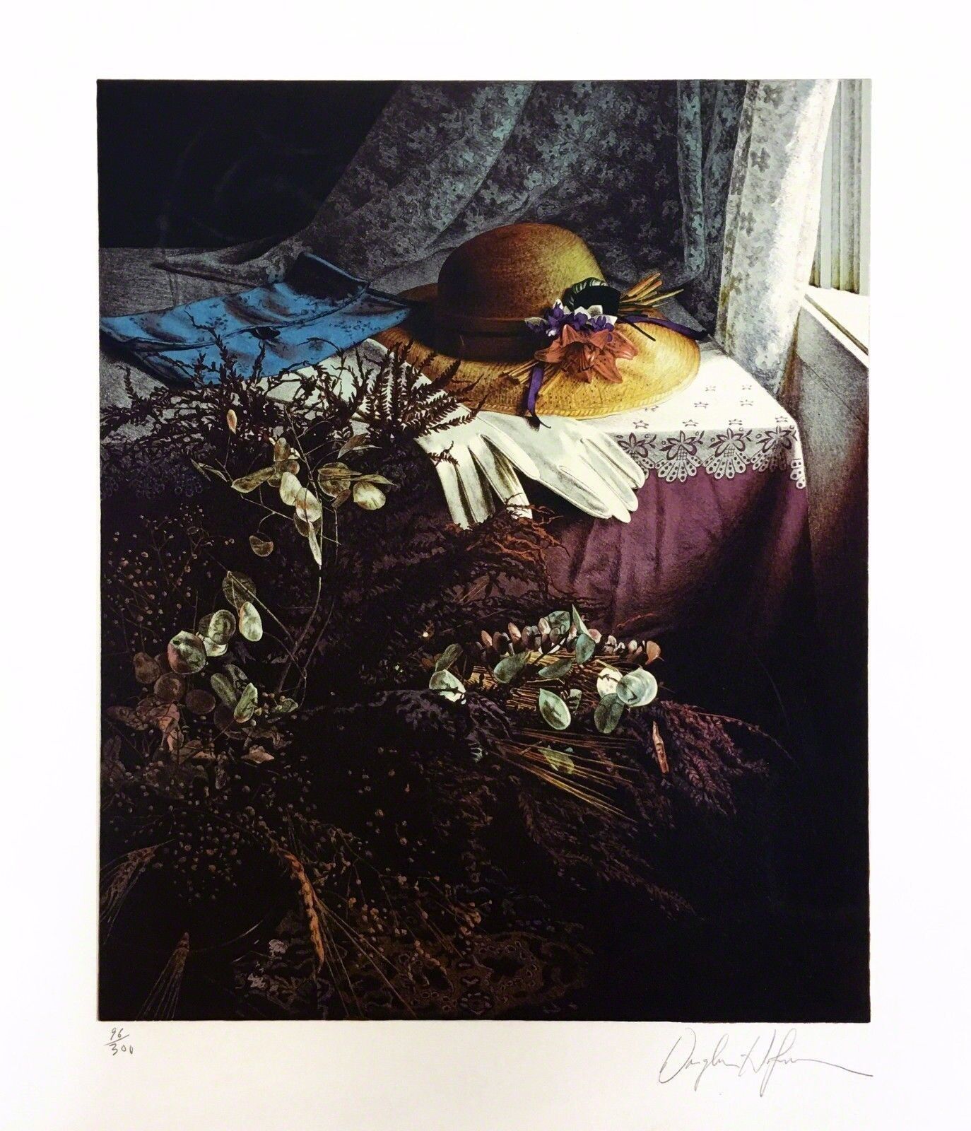 A picture of a hat and gloves on a table.