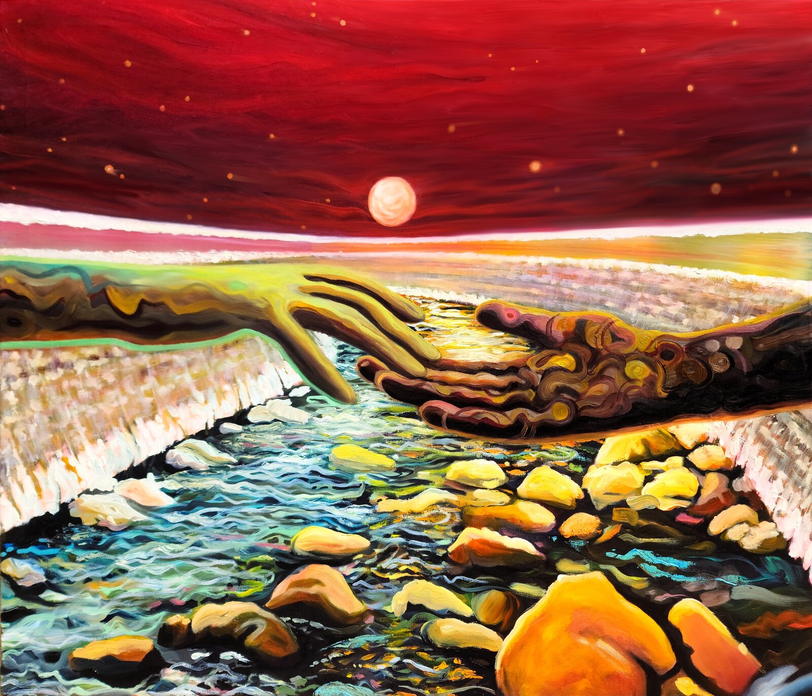 A surreal landscape where two hands reach across a rocky stream toward a glowing orb in a red sky.