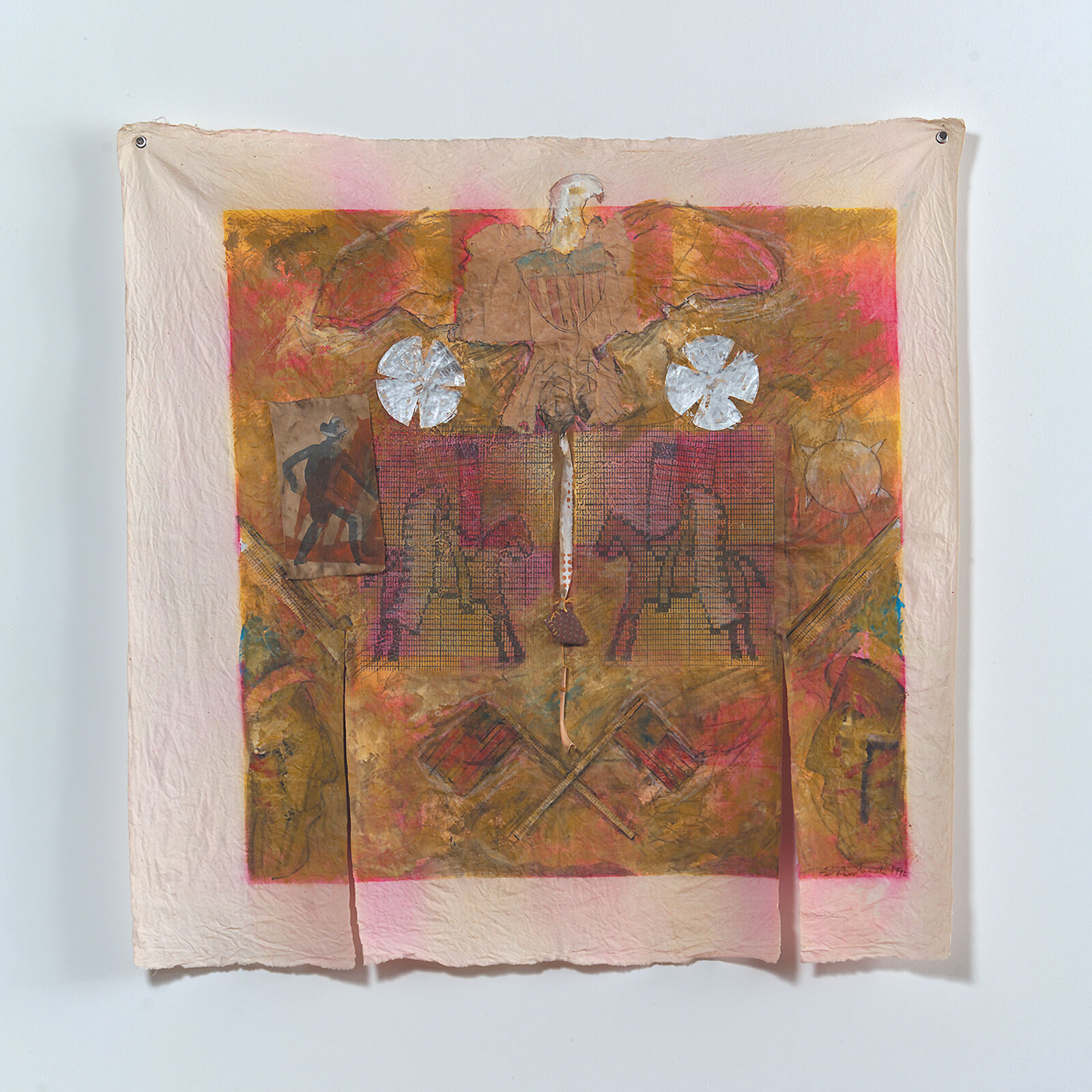 A mixed-media textile artwork featuring a central figure on horseback surrounded by symbolic elements.