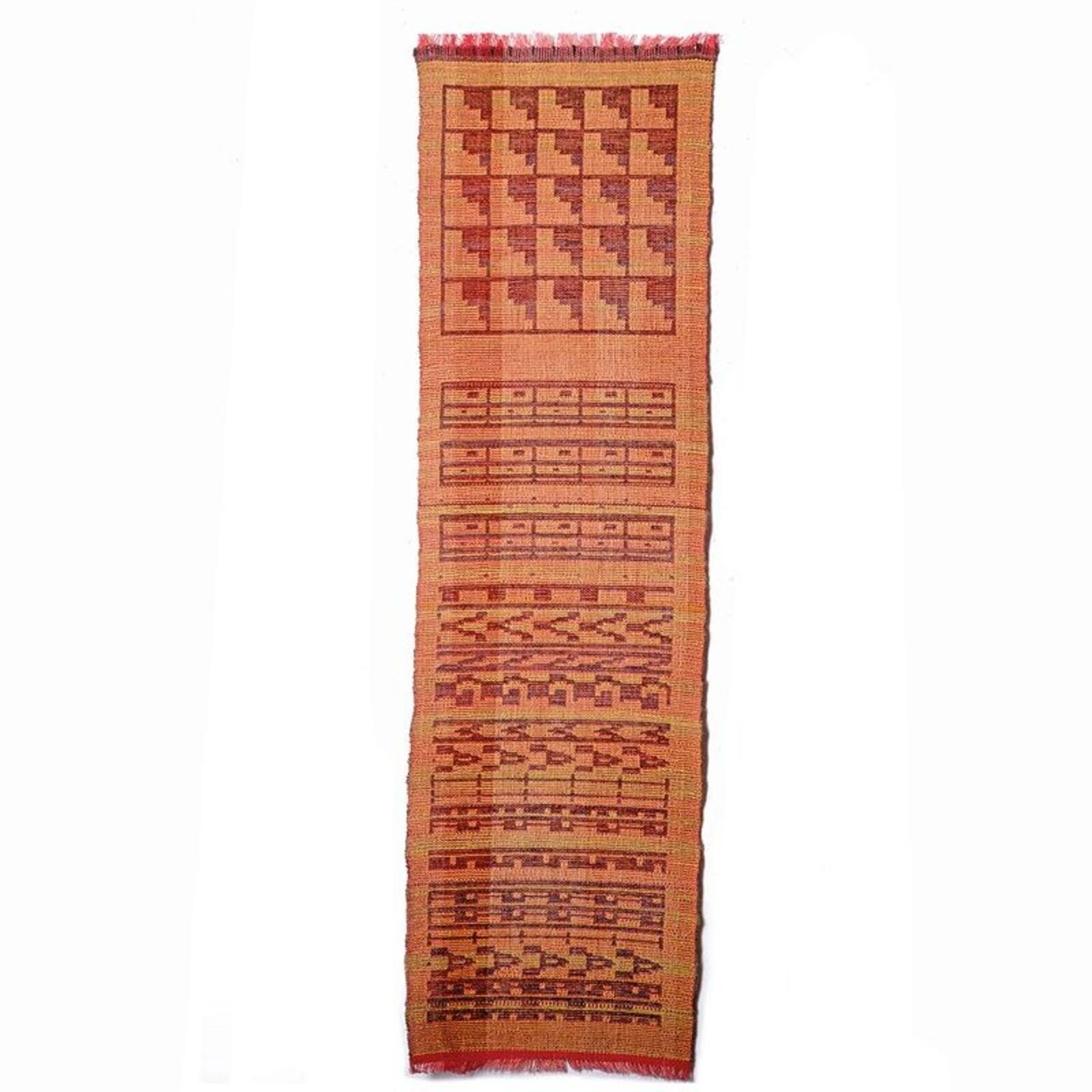 A framed woven textile featuring geometric patterns in earthy tones.